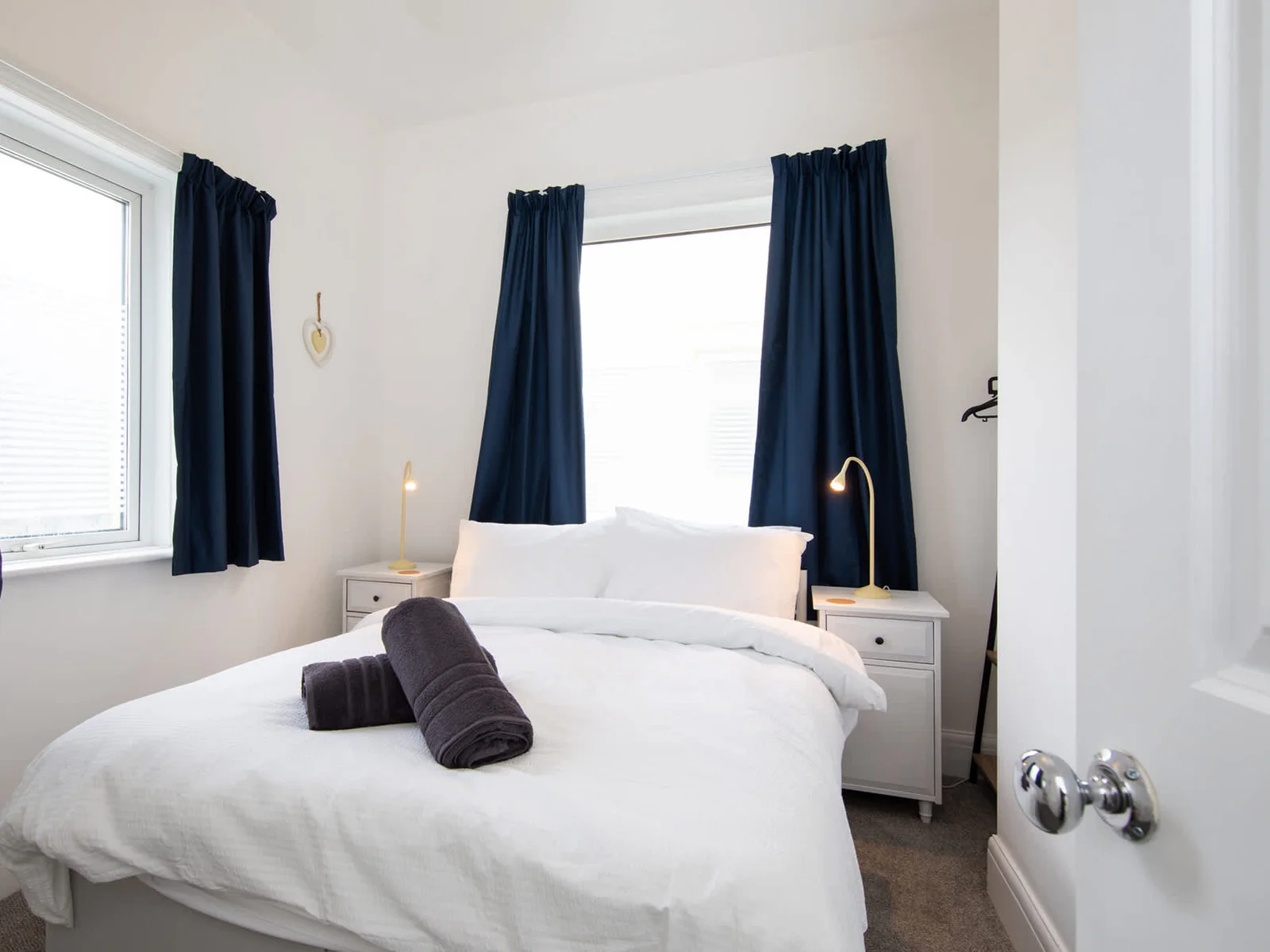 The elegant double bedroom filled with natural light