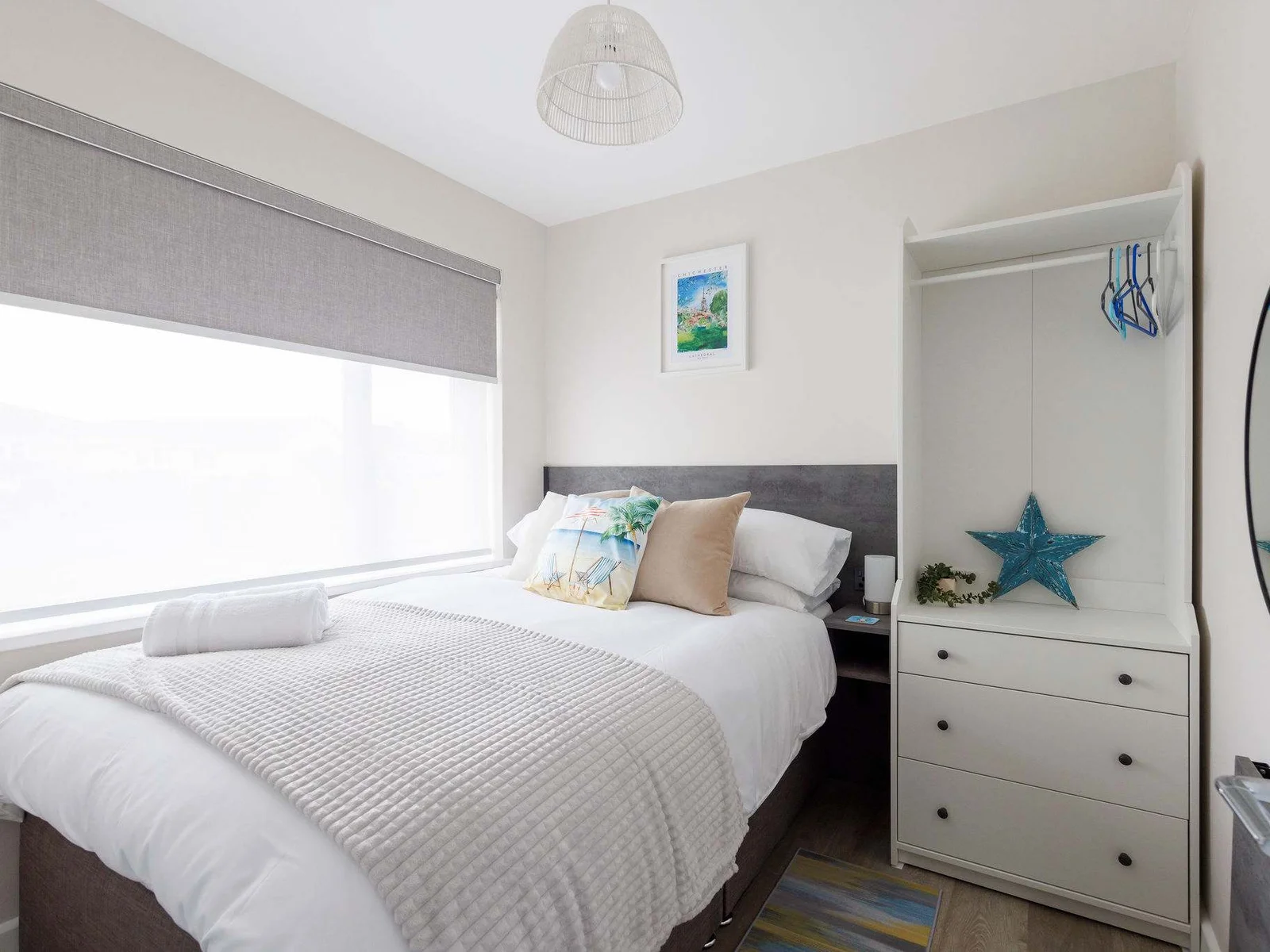 This double bedroom has a comfy bed and plenty of storage for belongings.
