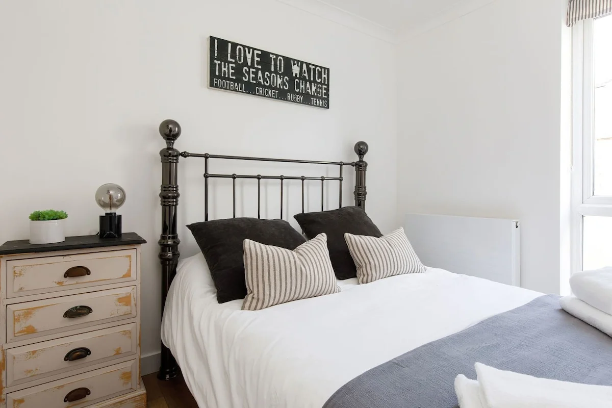 There is a bedside chest of drawers for your belongings.