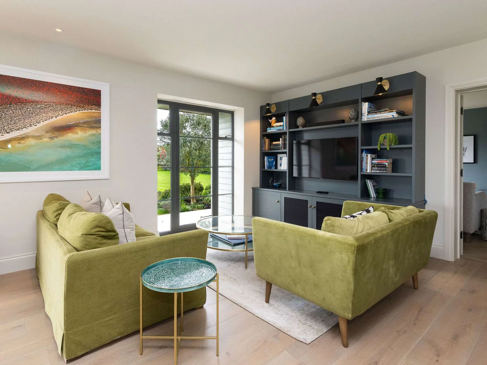 Kick back in the relaxed living area with Smart TV, garden views, and comfortable seating.