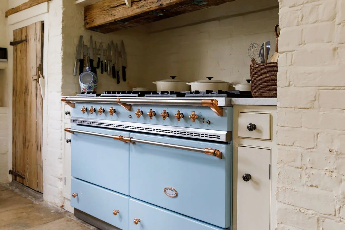 The impressive Lacanche range is the main feature of the home's rustic but fully functional kitchen.