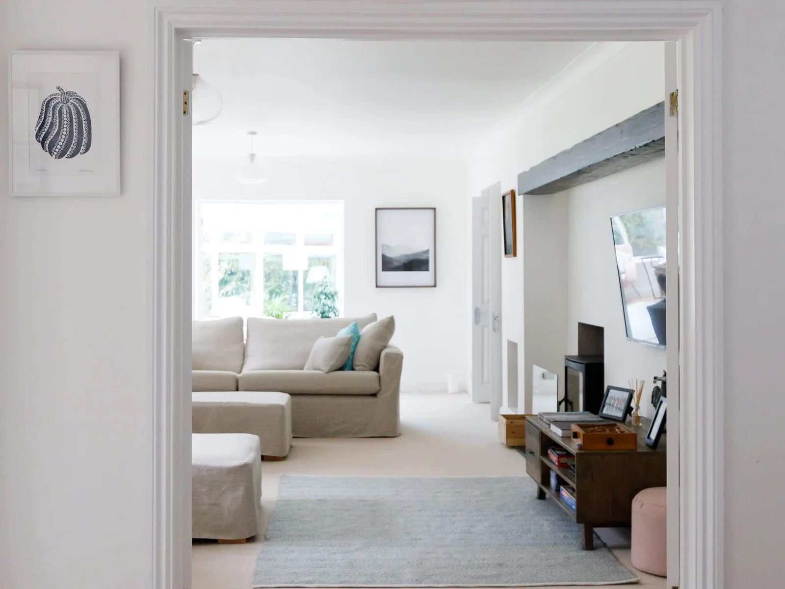 The lounge is spacious yet cosy, with deep comfy sofas and a log burner.