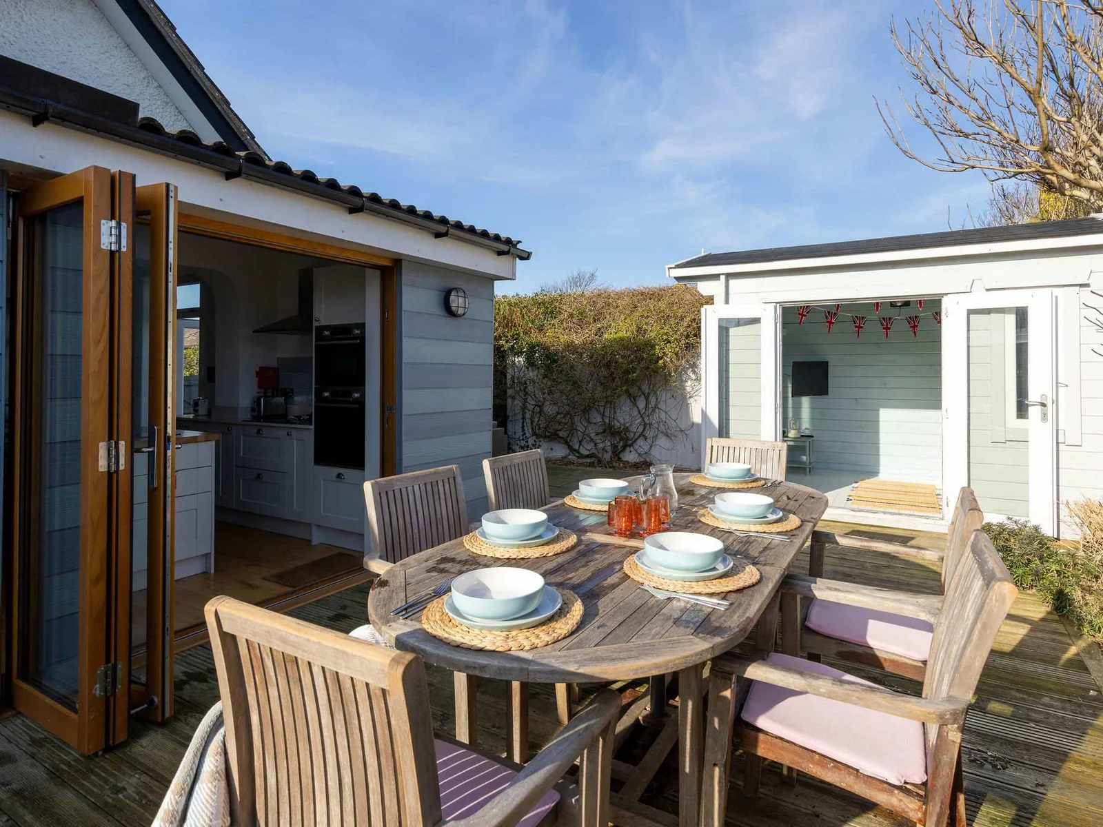 Enjoy outdoor dining on the sunny deck with seating for six, perfect for family meals. This charming cottage offers a wonderful space for relaxation and making memories.