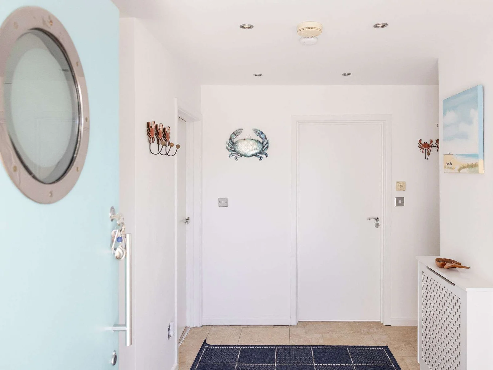 Bright, coastal-style hallway with charming details