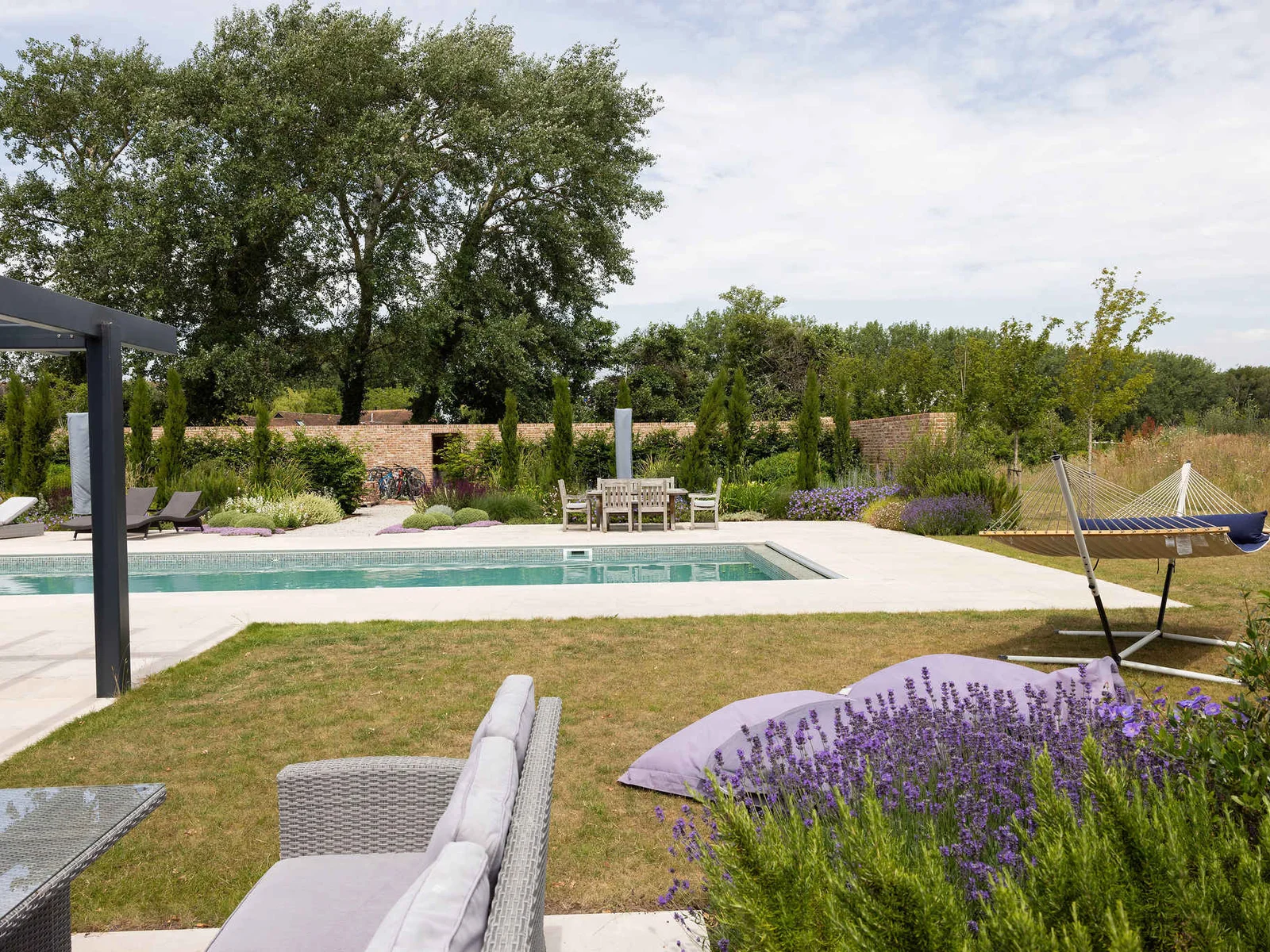 Unwind in the hammock or recline on sun loungers overlooking the peaceful private gardens.