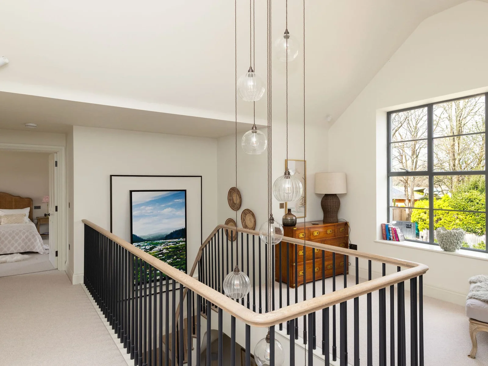 Elegant landing flooded with natural light, showcasing the home's stunning architectural character throughout.