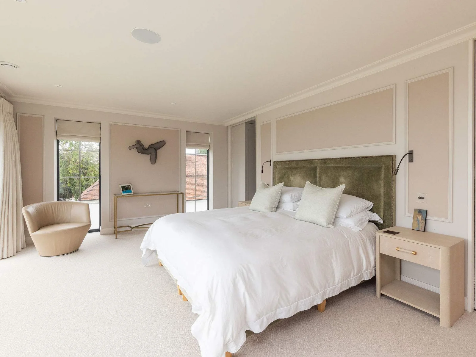 Luxurious main bedroom suite with super king bed and access to private balcony