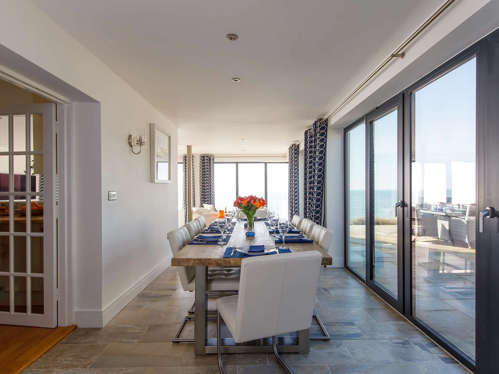 The dining room has a large table to seat up to 8 guests, with incredible views as you dine.