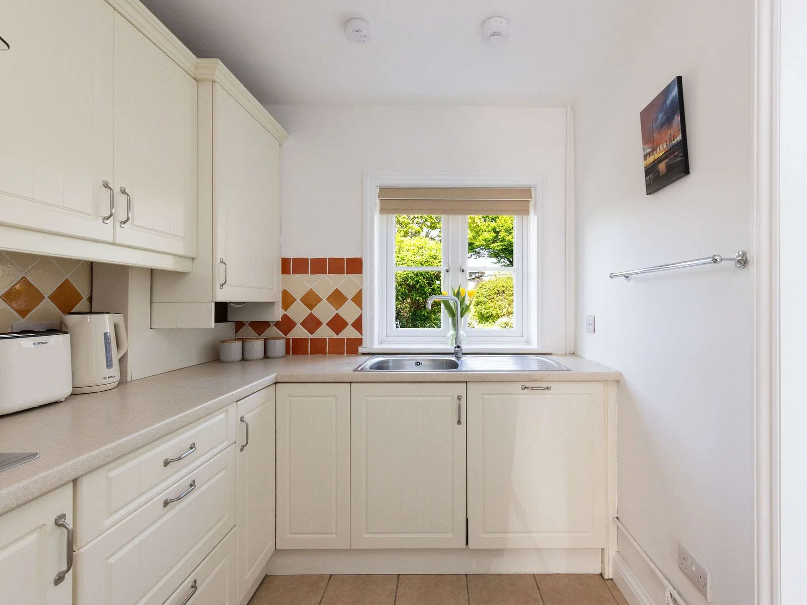 The kitchen has everything you need to prepare drinks and meals.