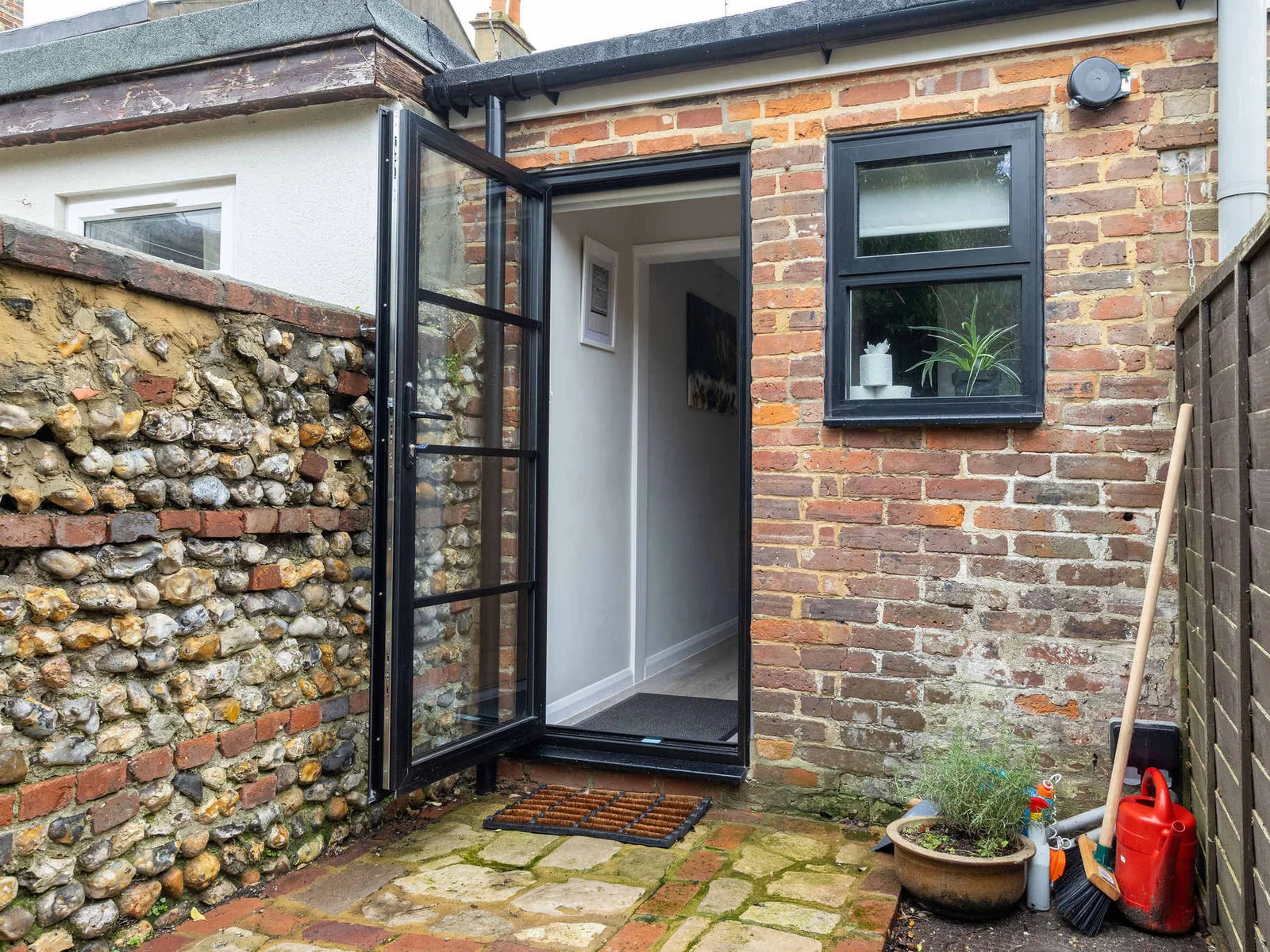 Step out to the enclosed courtyard at the rear of the property!