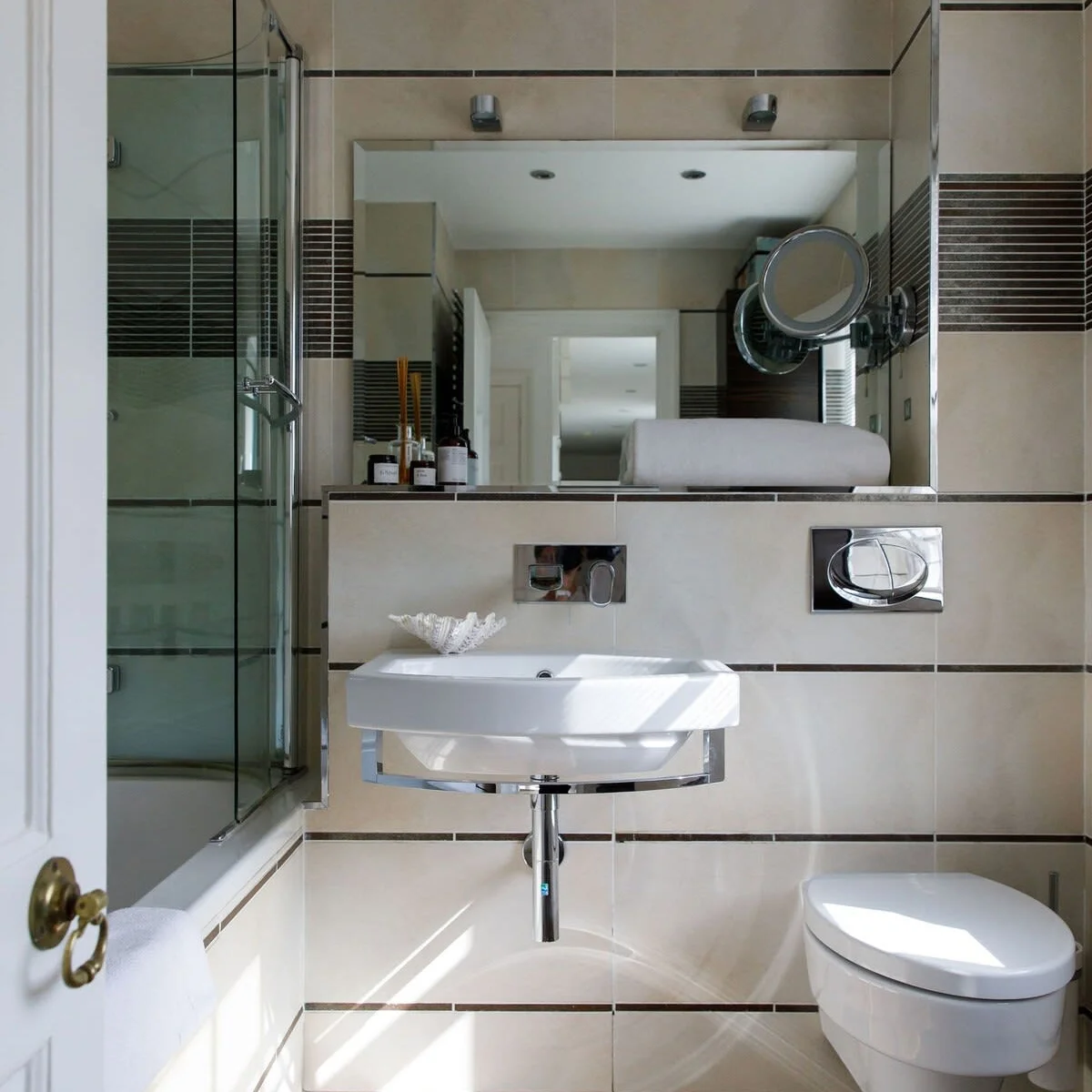 The spacious family bathroom has a bath, WC and sink.