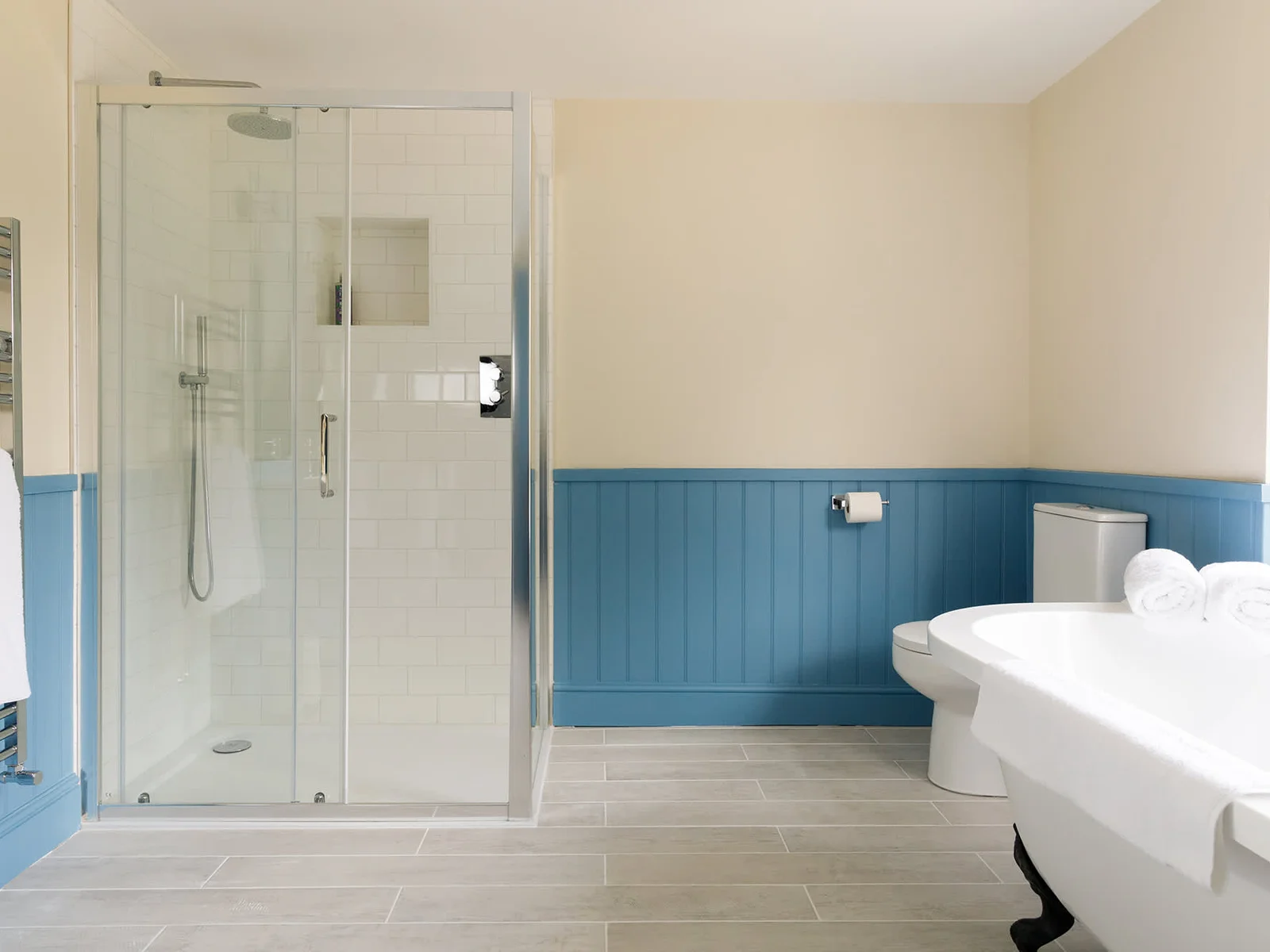 The large ensuite has a free standing bath and separate shower.