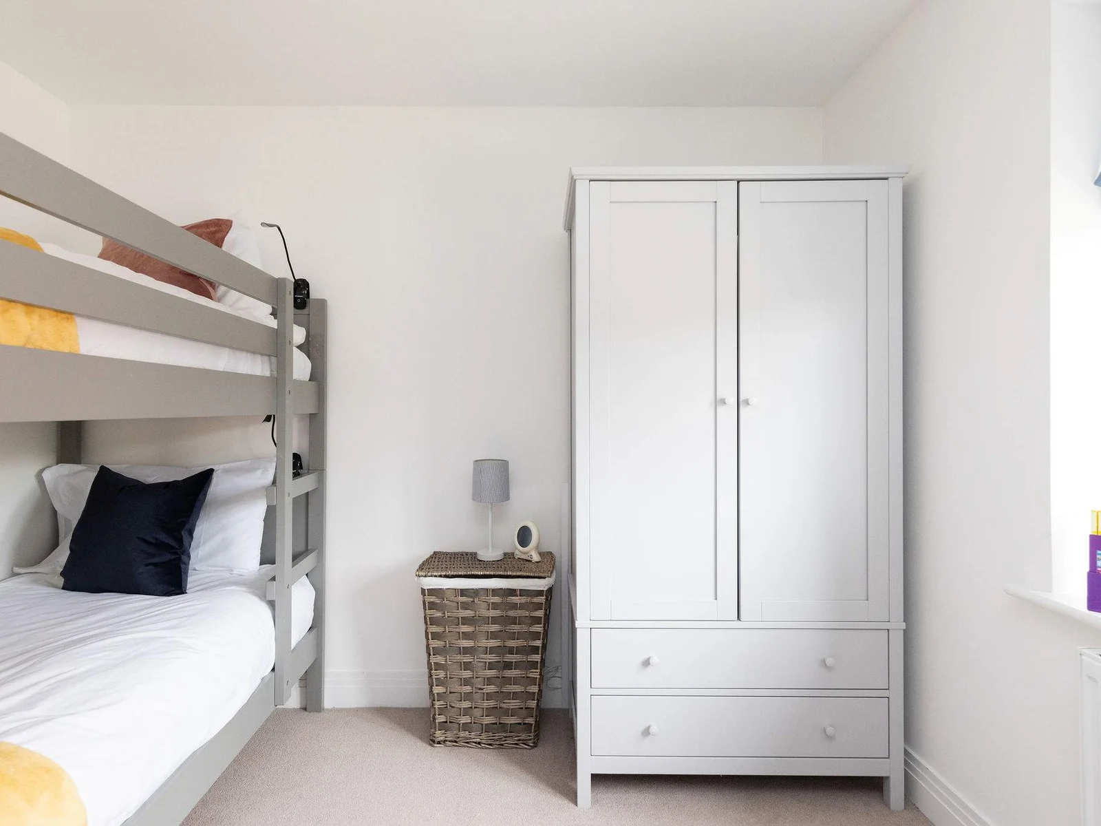This bedroom has a full-size wardrobe.