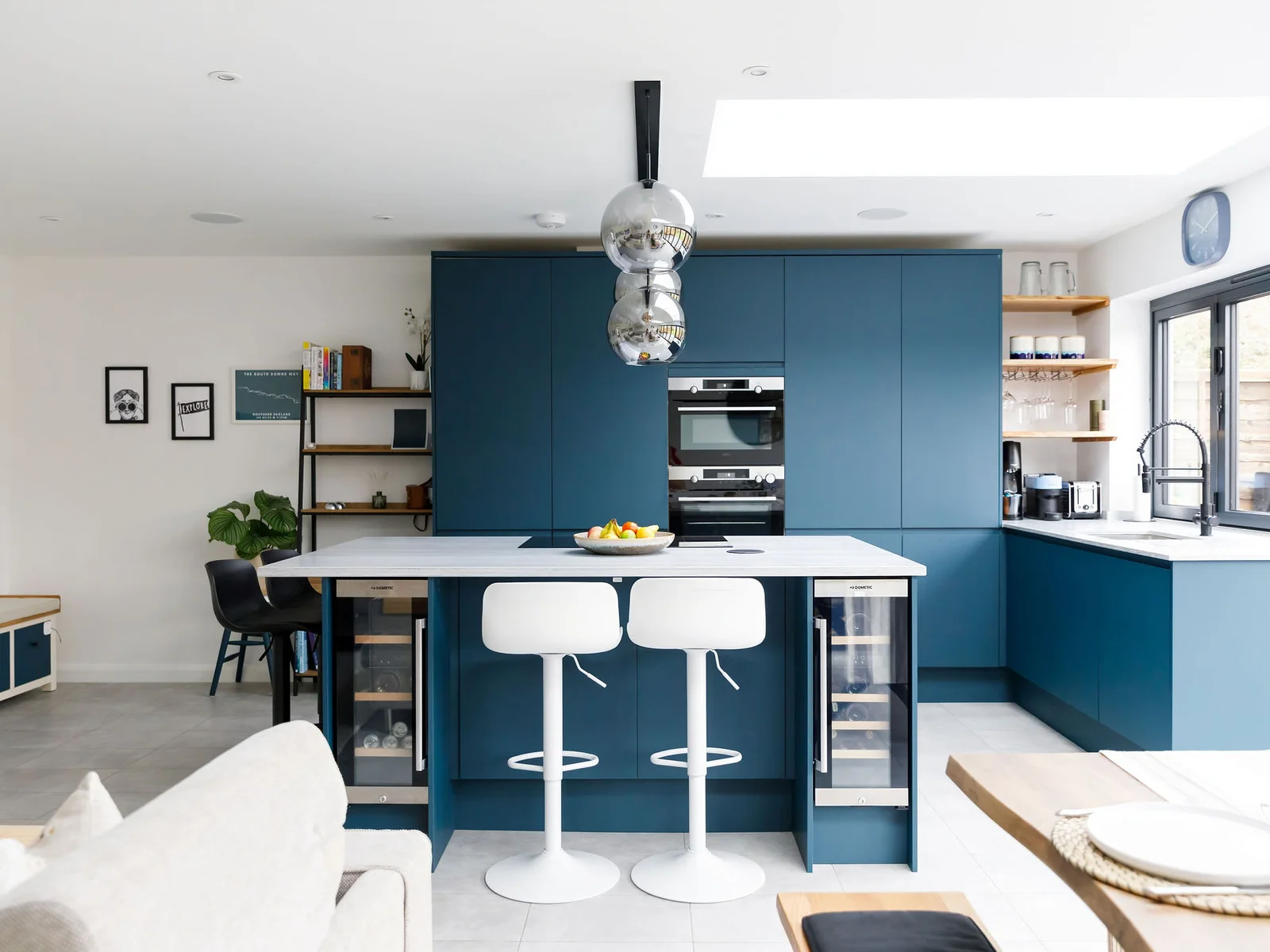 The dark coloured cabinetry makes this a gorgeous statement kitchen.