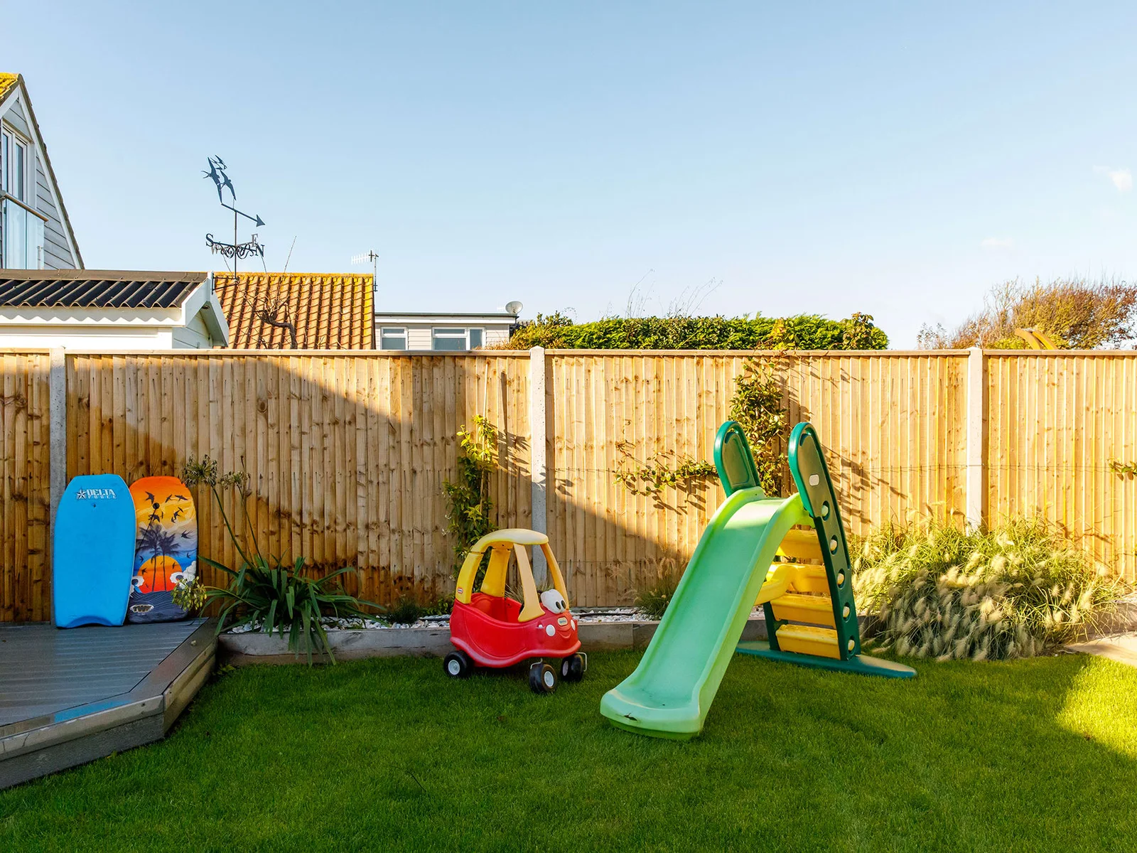 The house is a fantastic family home, with play equipment, toys and a lawn for ball games.