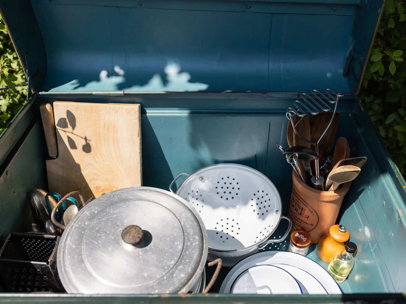 A varied selection of outdoor cooking supplies is provided