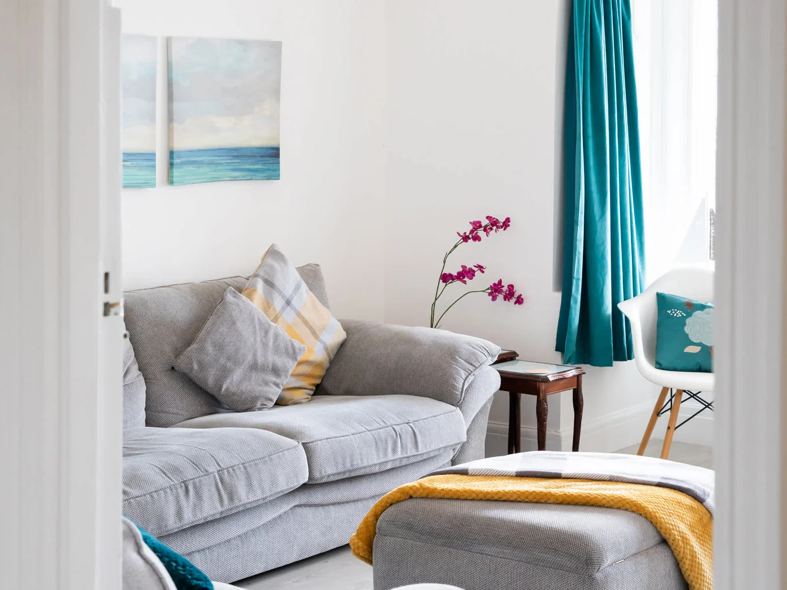 Enter our sunny lounge with lovely sea views