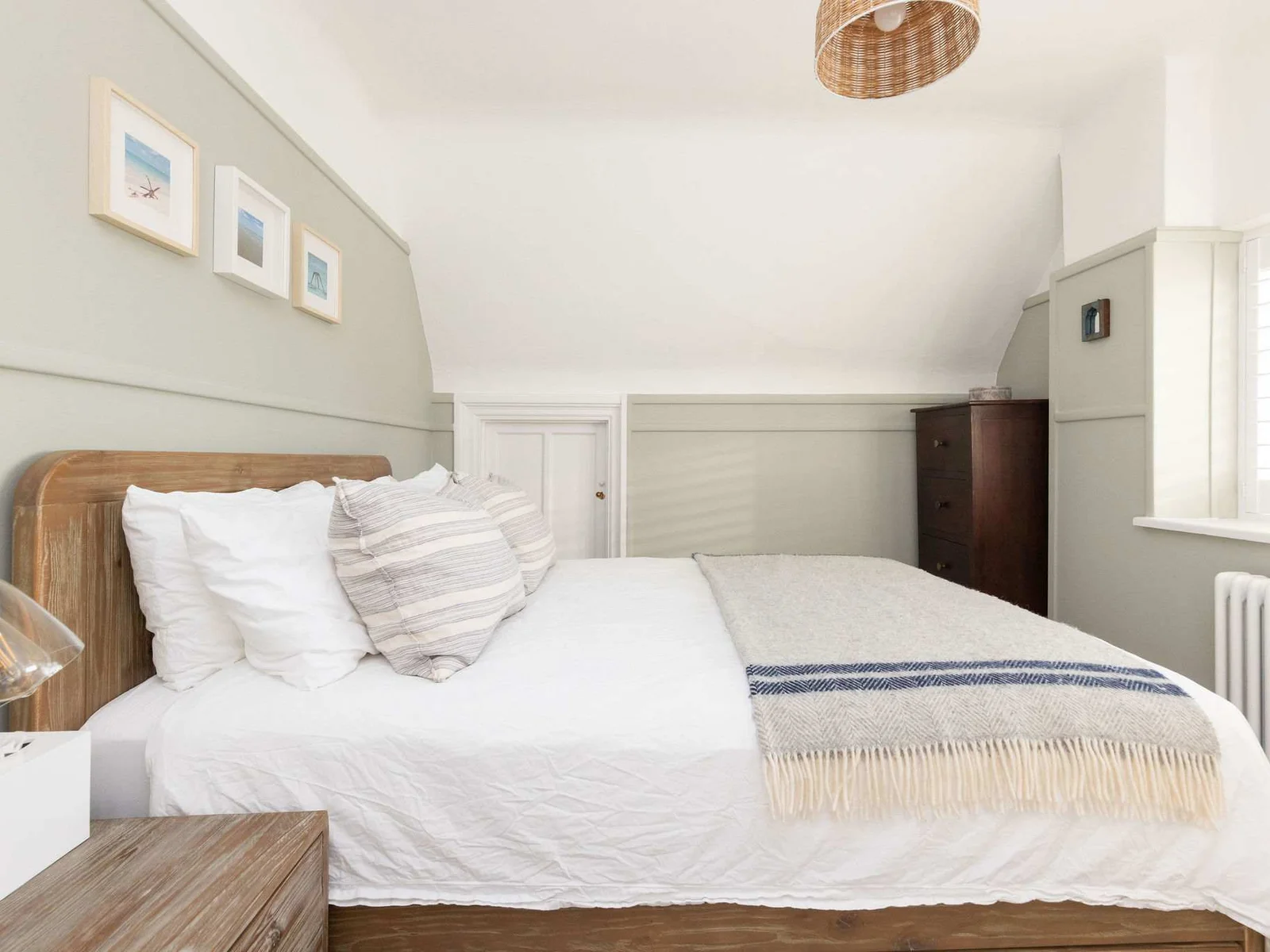 Cosy bedroom with stylish coastal decor.