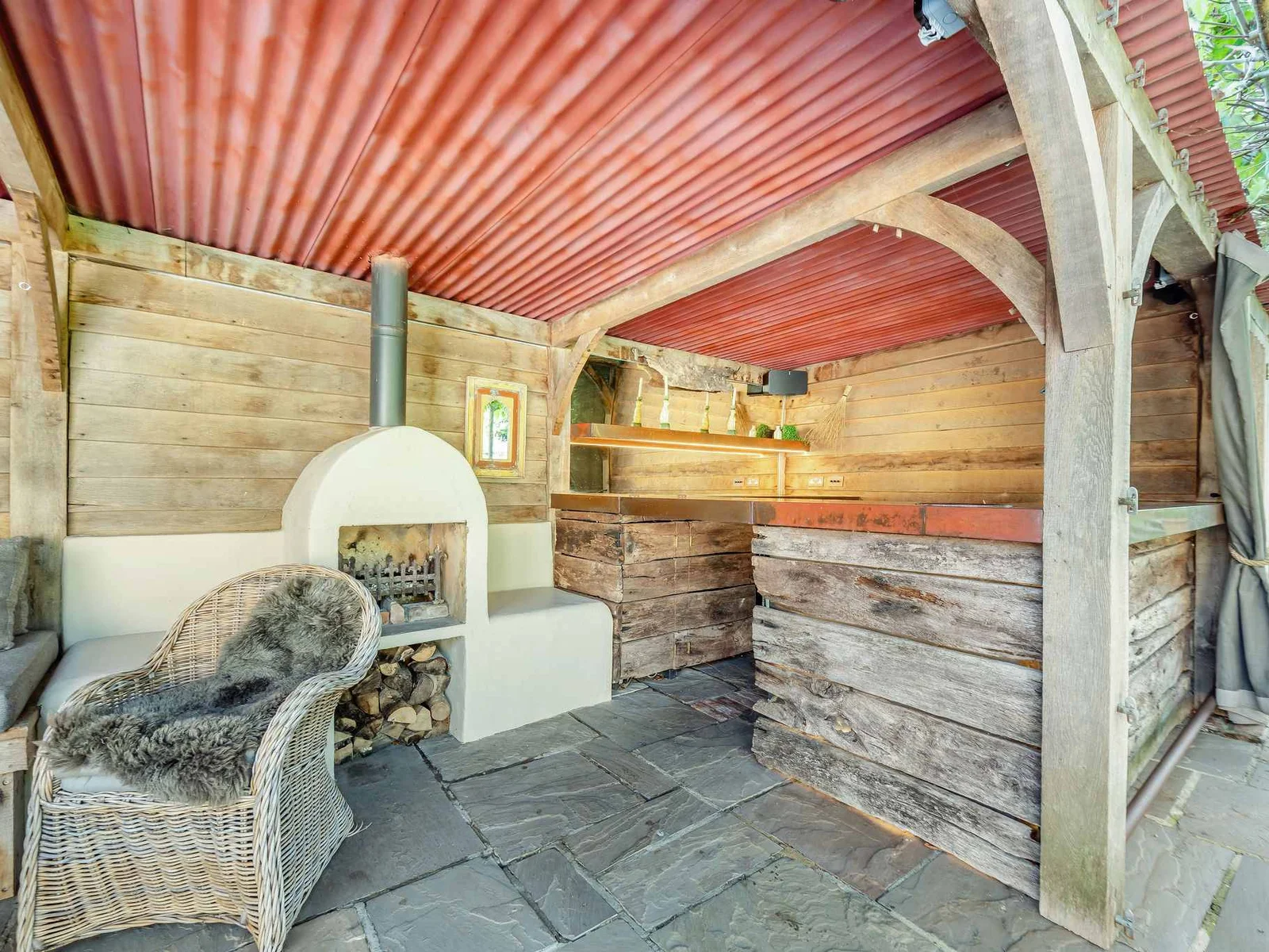 The rustic poolside bar and fireplace, made for evening drinks