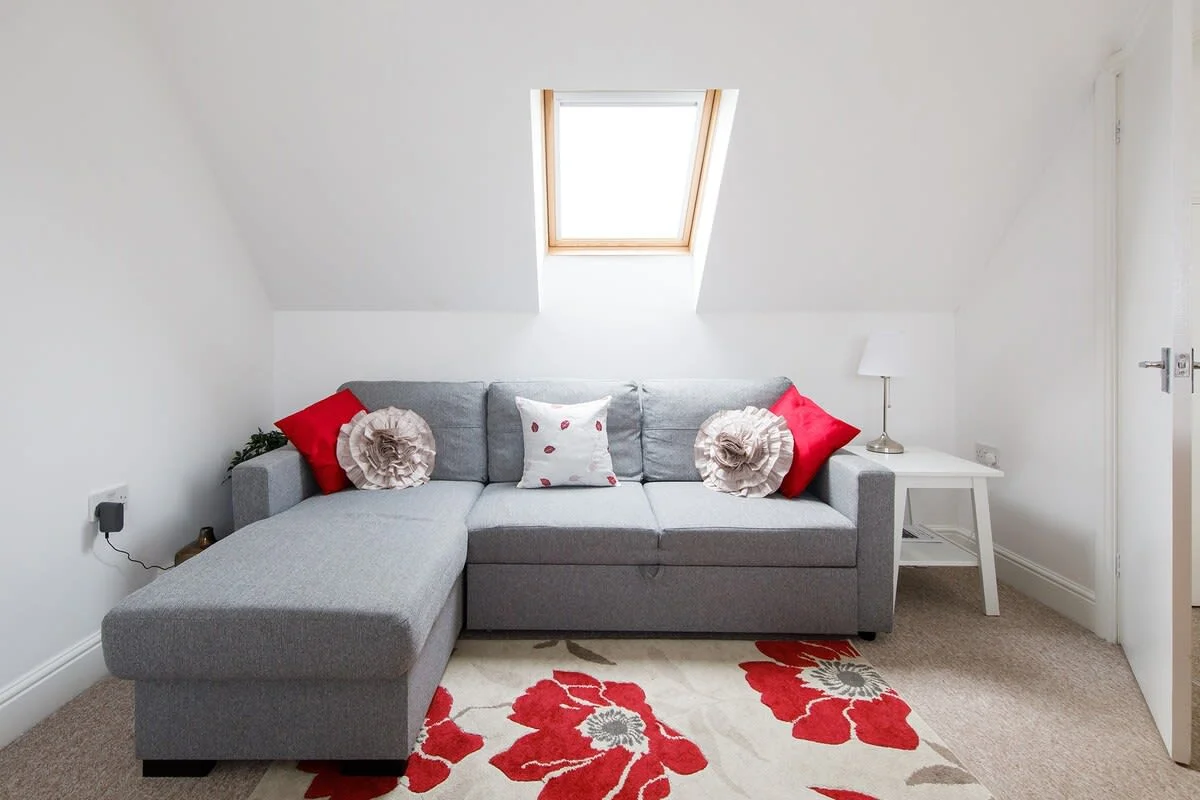 Relax and unwind on the sofa with a drink after a day exploring.