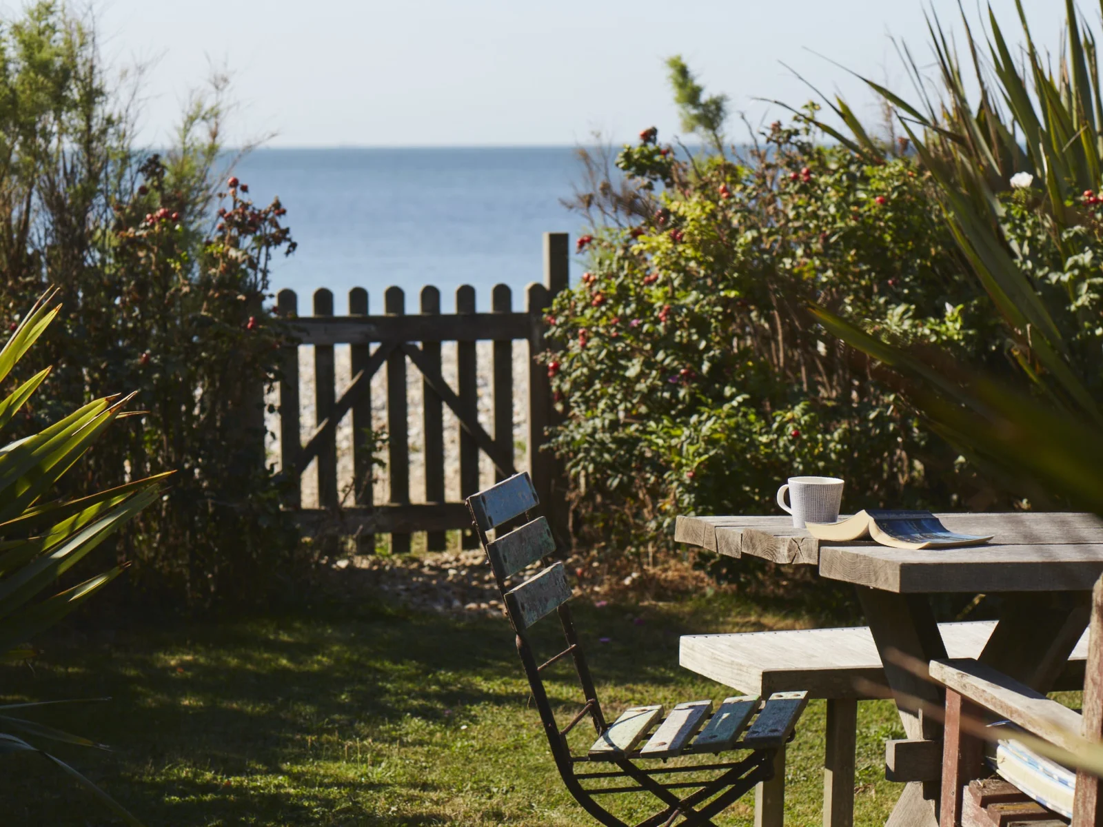Unwind in our beautiful garden with direct access to the beach, perfect for morning coffee or an afternoon read