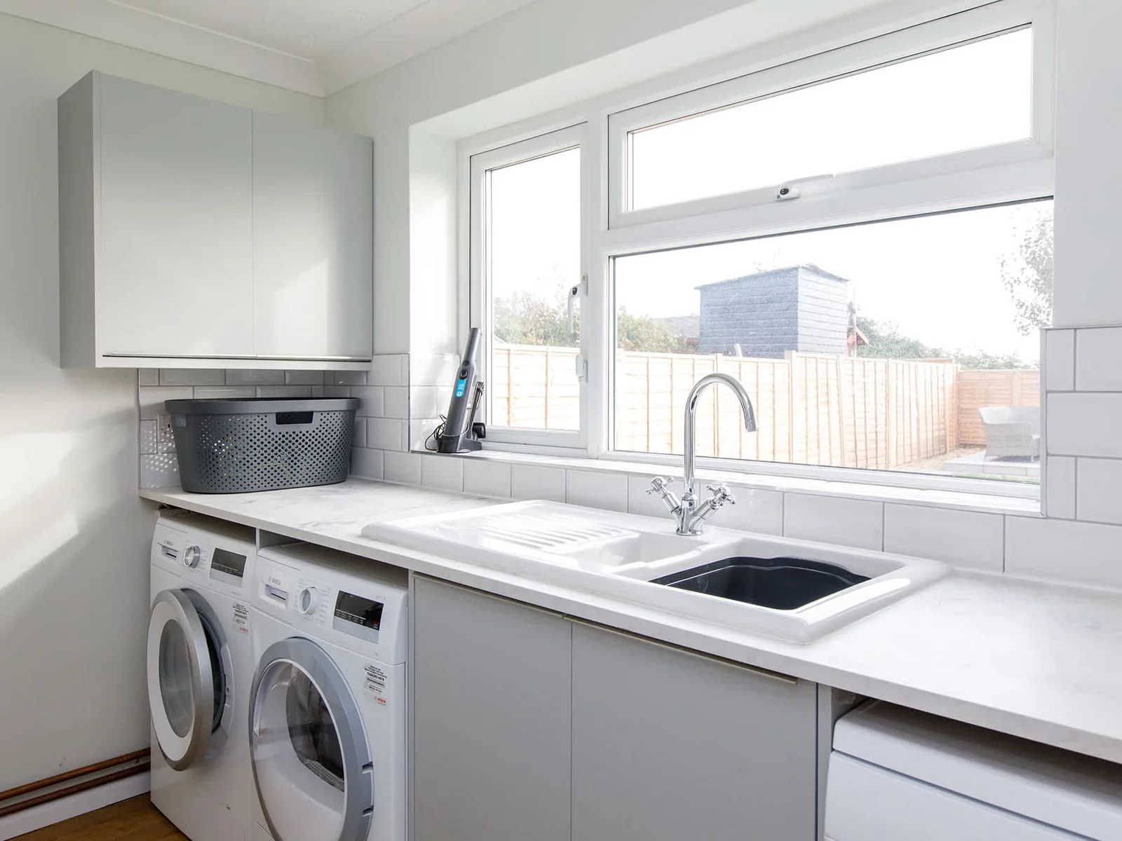 The handy utility room has a washer and dryer.