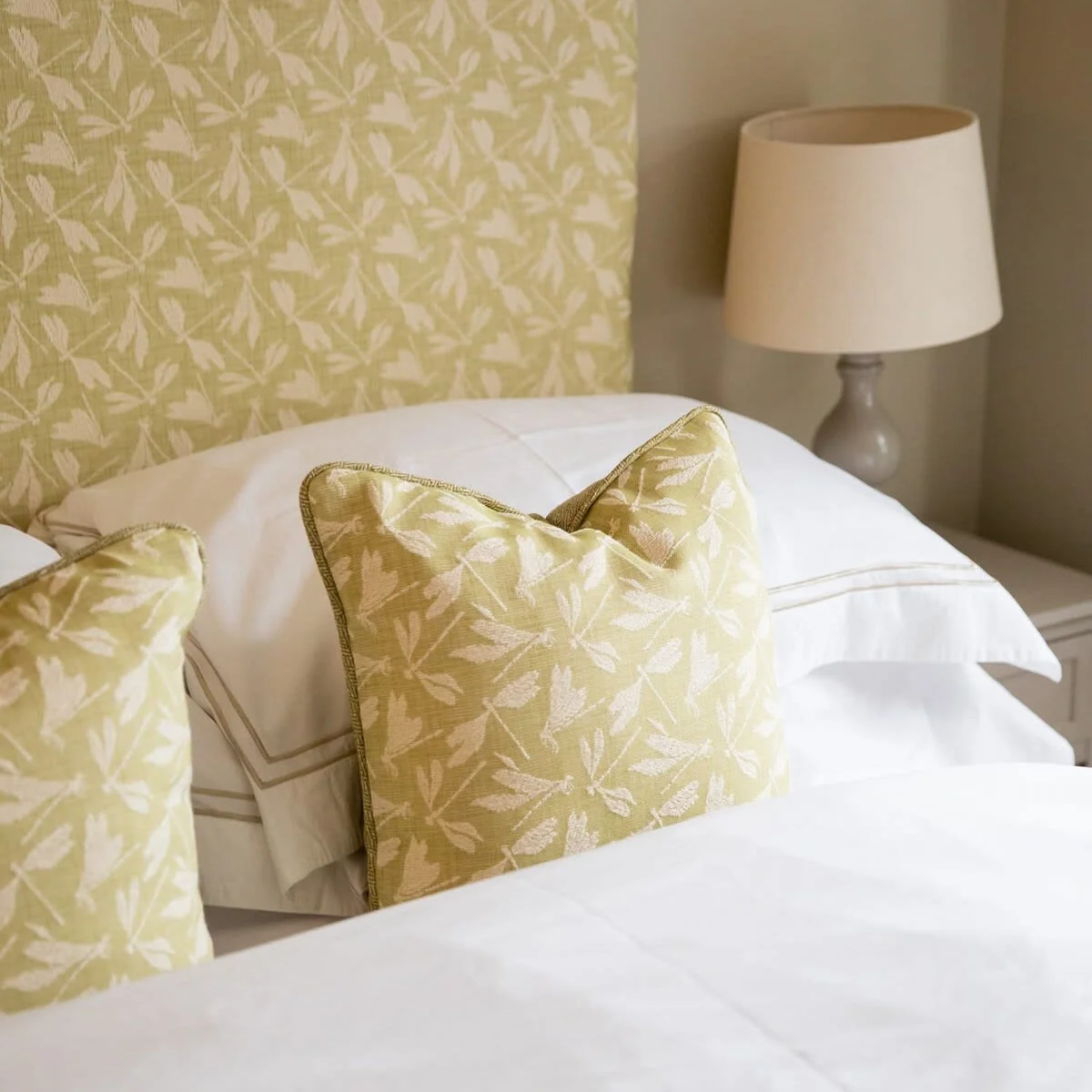 The bedrooms are adorned with pretty cushions.