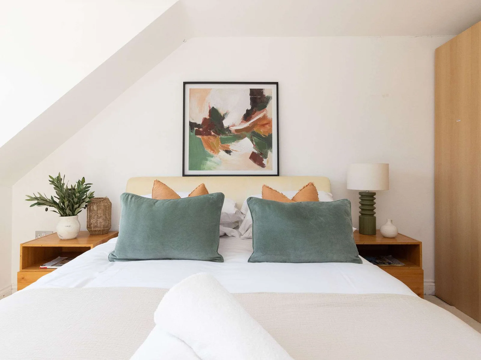 Enjoy a peaceful night of sleep in the plush bed of our modern retreat.