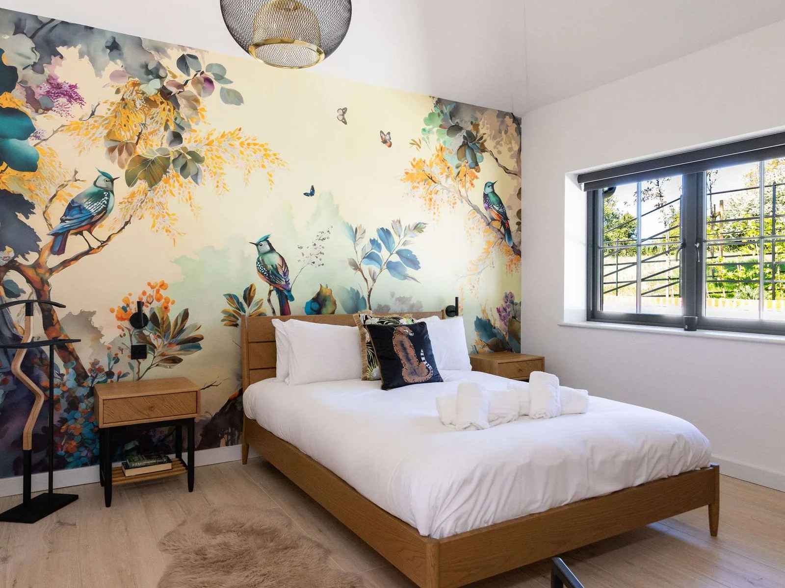 Sleep easy in a stylish king bedroom, surrounded by calming colours and a soft countryside feel.