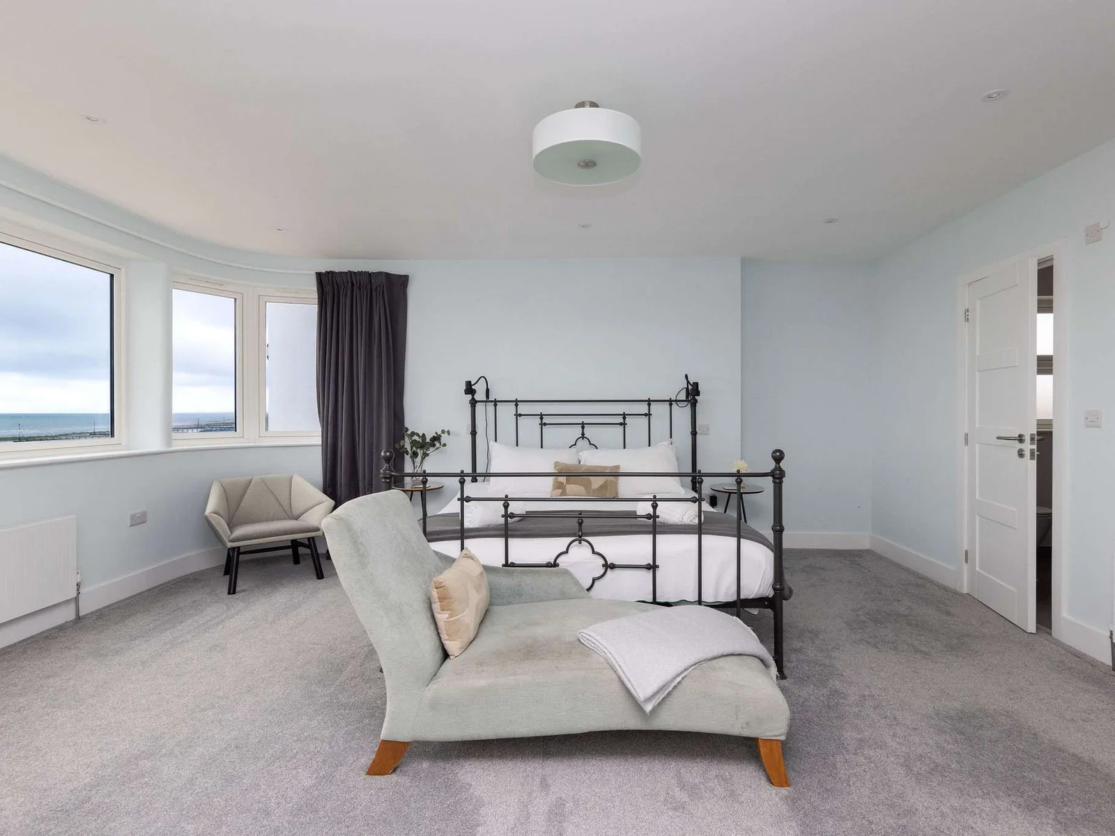 A beautifully spacious master suite with the sea just beyond