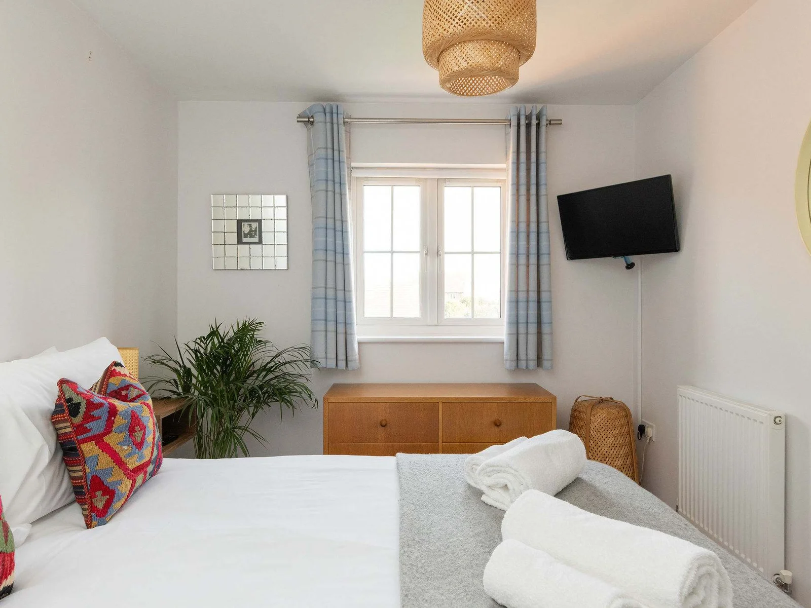 A restful double bedroom with its own TV.