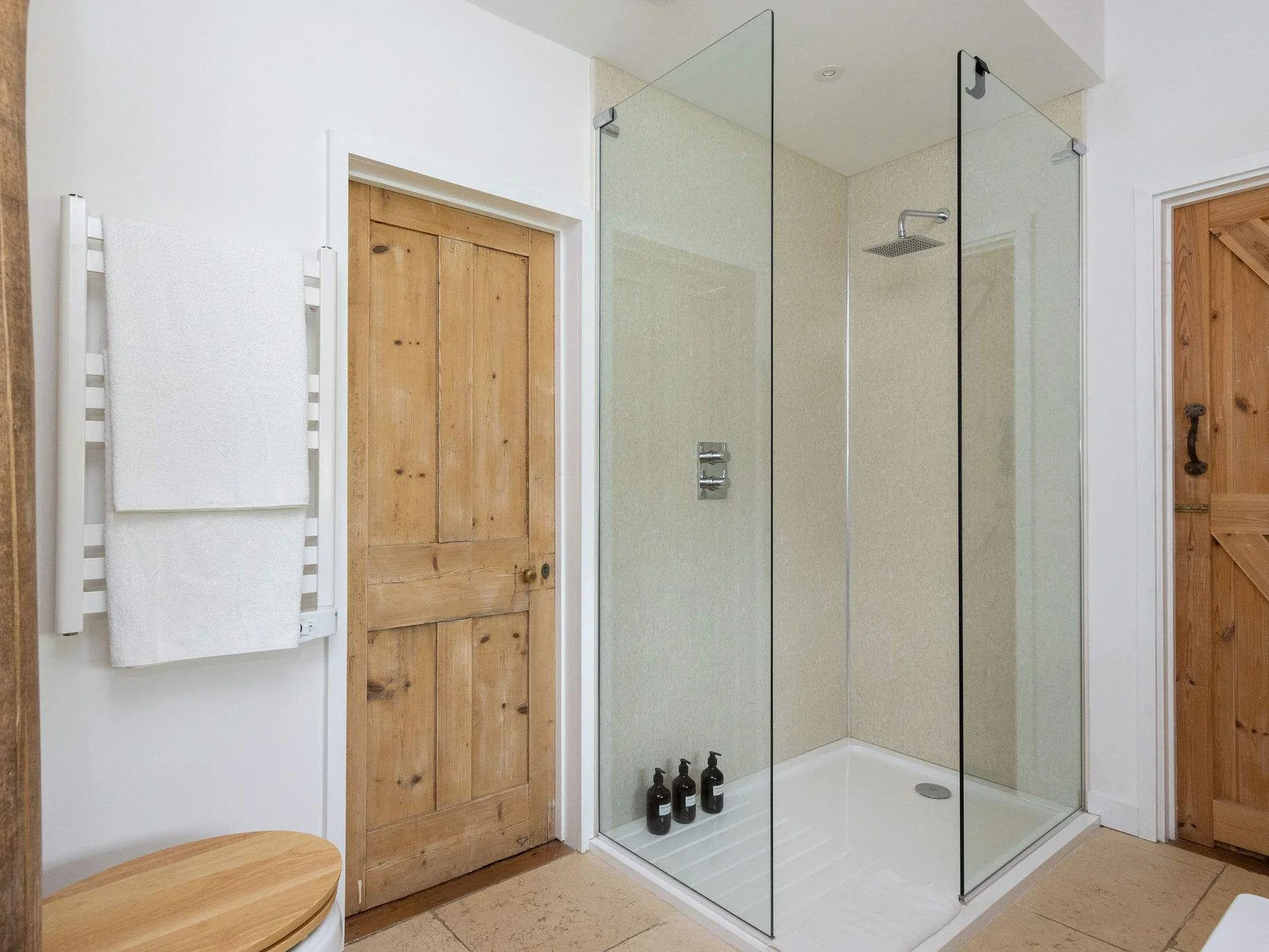 Fresh, well-appointed bathrooms with natural wood touches — everything you need to unwind.