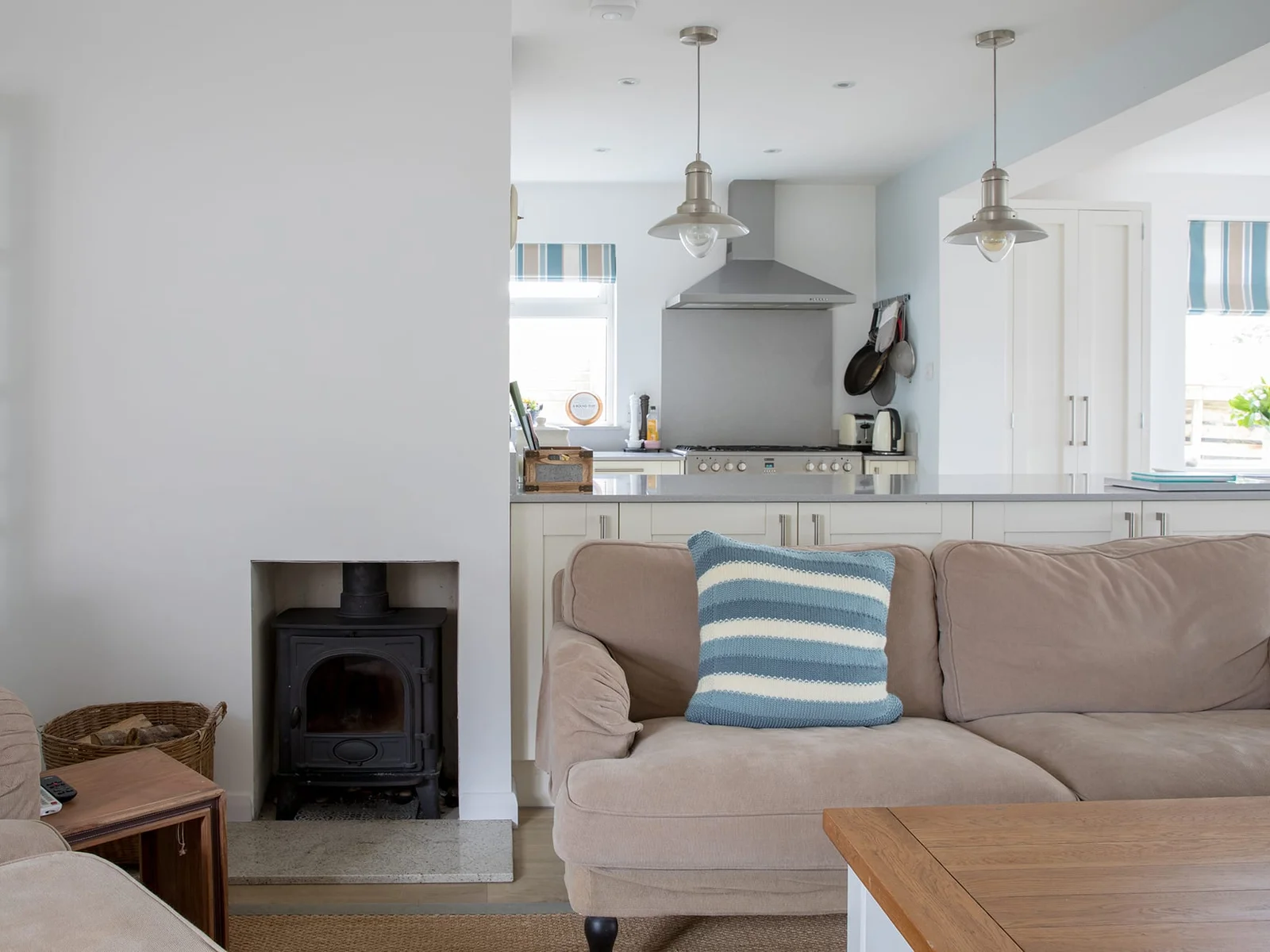Charming wood-burning fireplace is a perfect gathering point during cold winter nights.