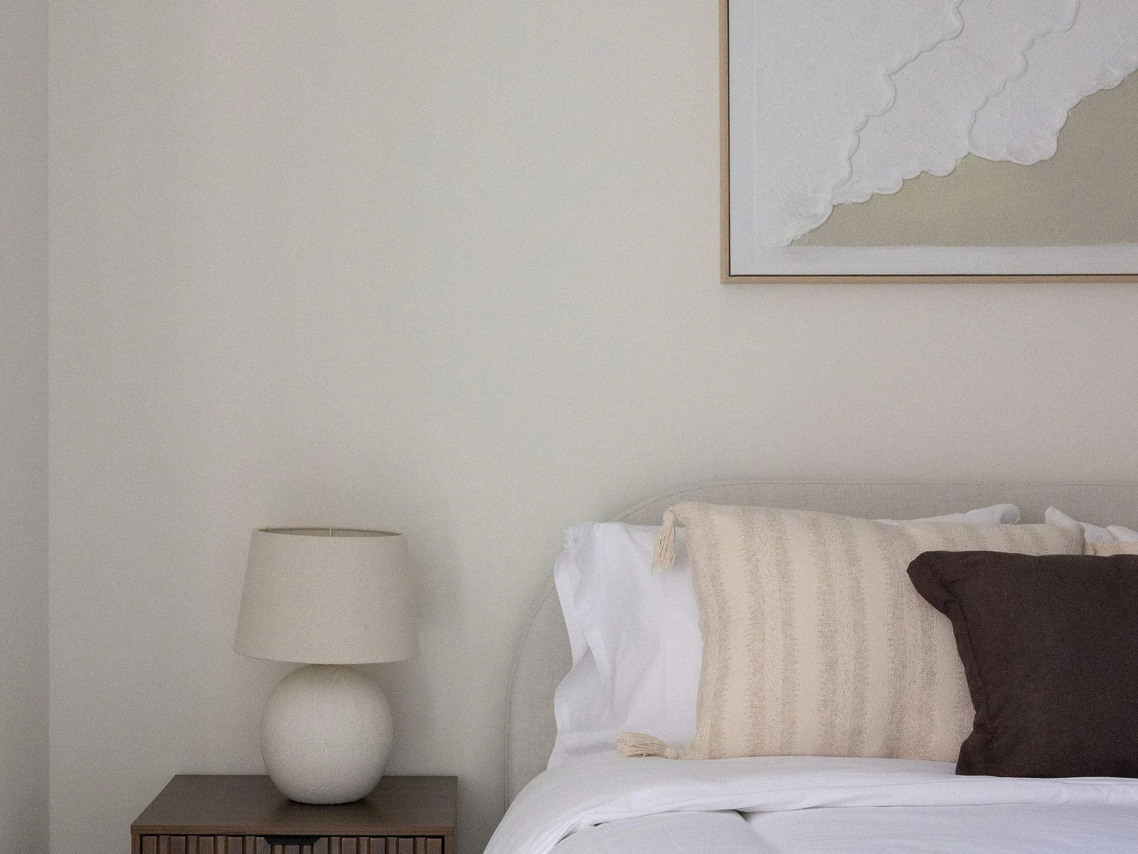 Elegant king bed with quality linen, ensuring a restful stay in central Chichester.