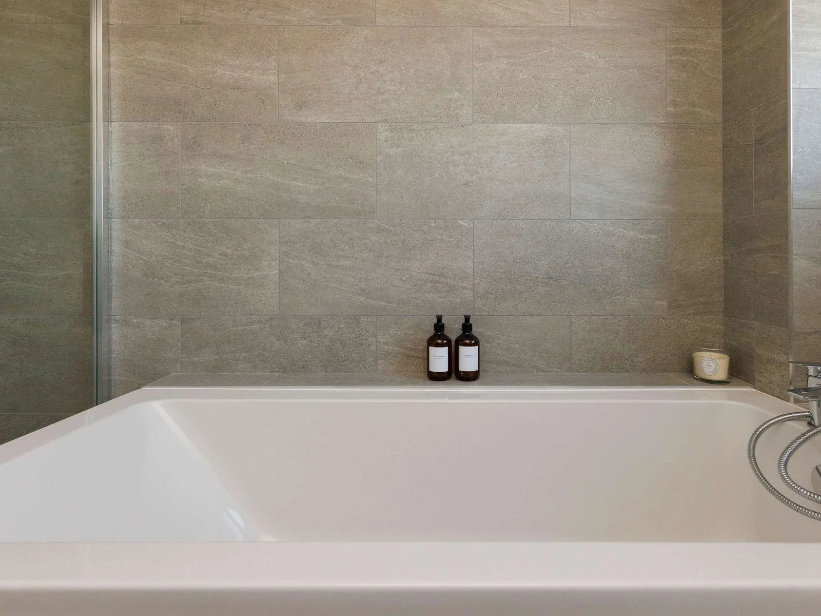 Relax in a luxurious bathtub after a day by the sea