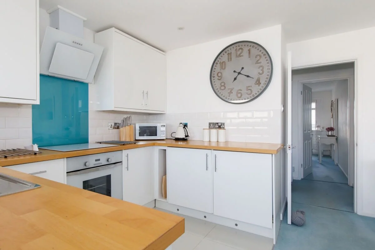 The apartment is clean and light, with plenty of kitchen space to prepare meals.