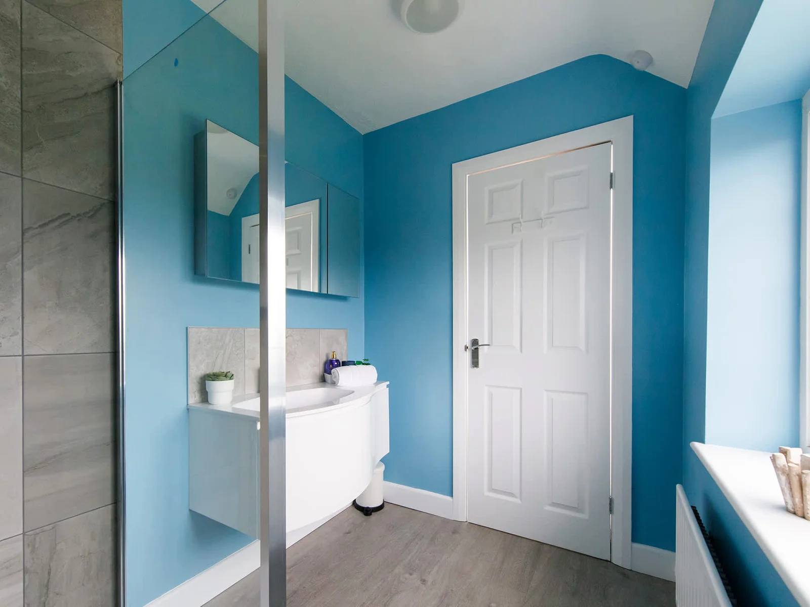 The master bedroom has a spacious ensuite with large walk-in shower.