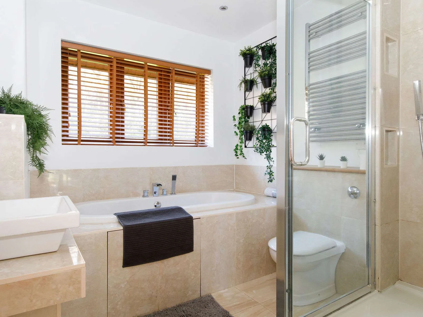 The family bathroom has a bath, separate walk-in shower, WC and sink.