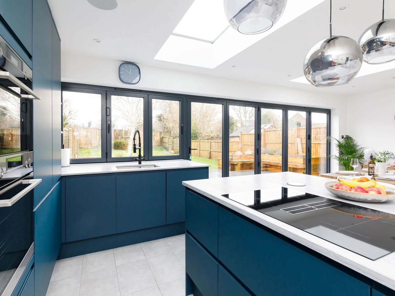 The modern kitchen is fully equipped with state-of-the-art appliances, spacious countertops and ample cabinetry for preparing and cooking.