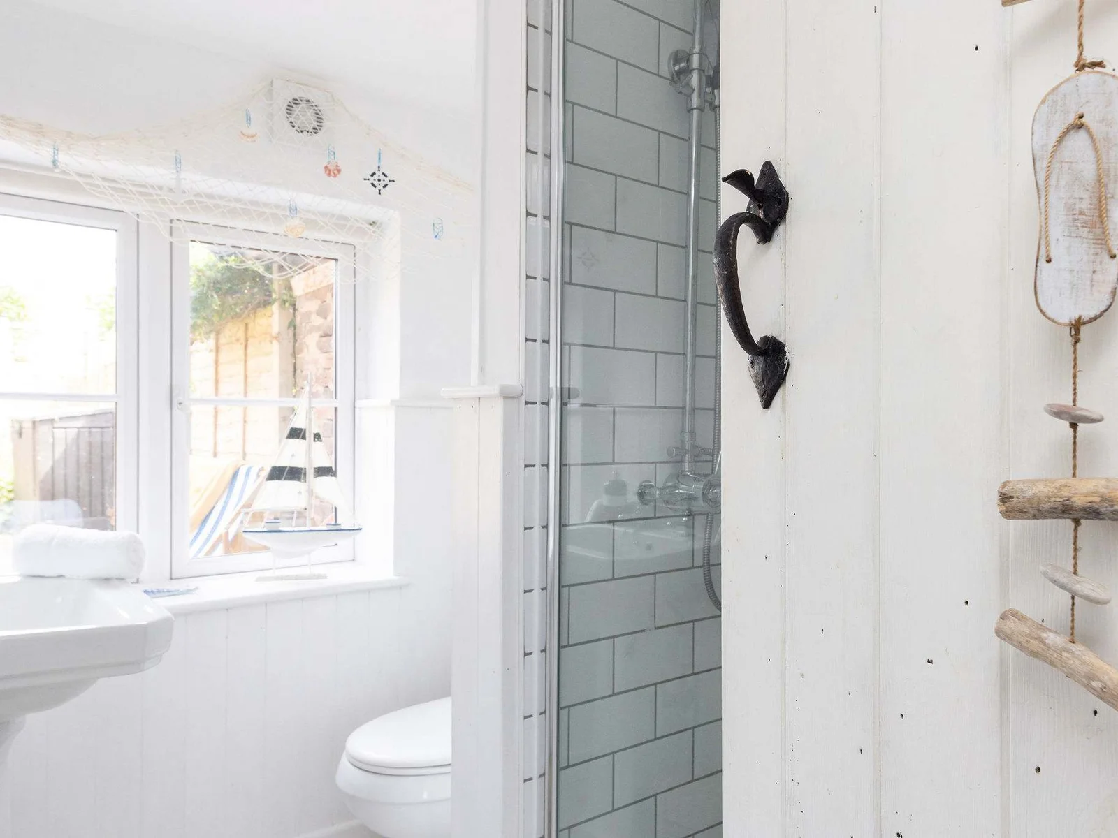 This bathroom features a seaside nautical theme!