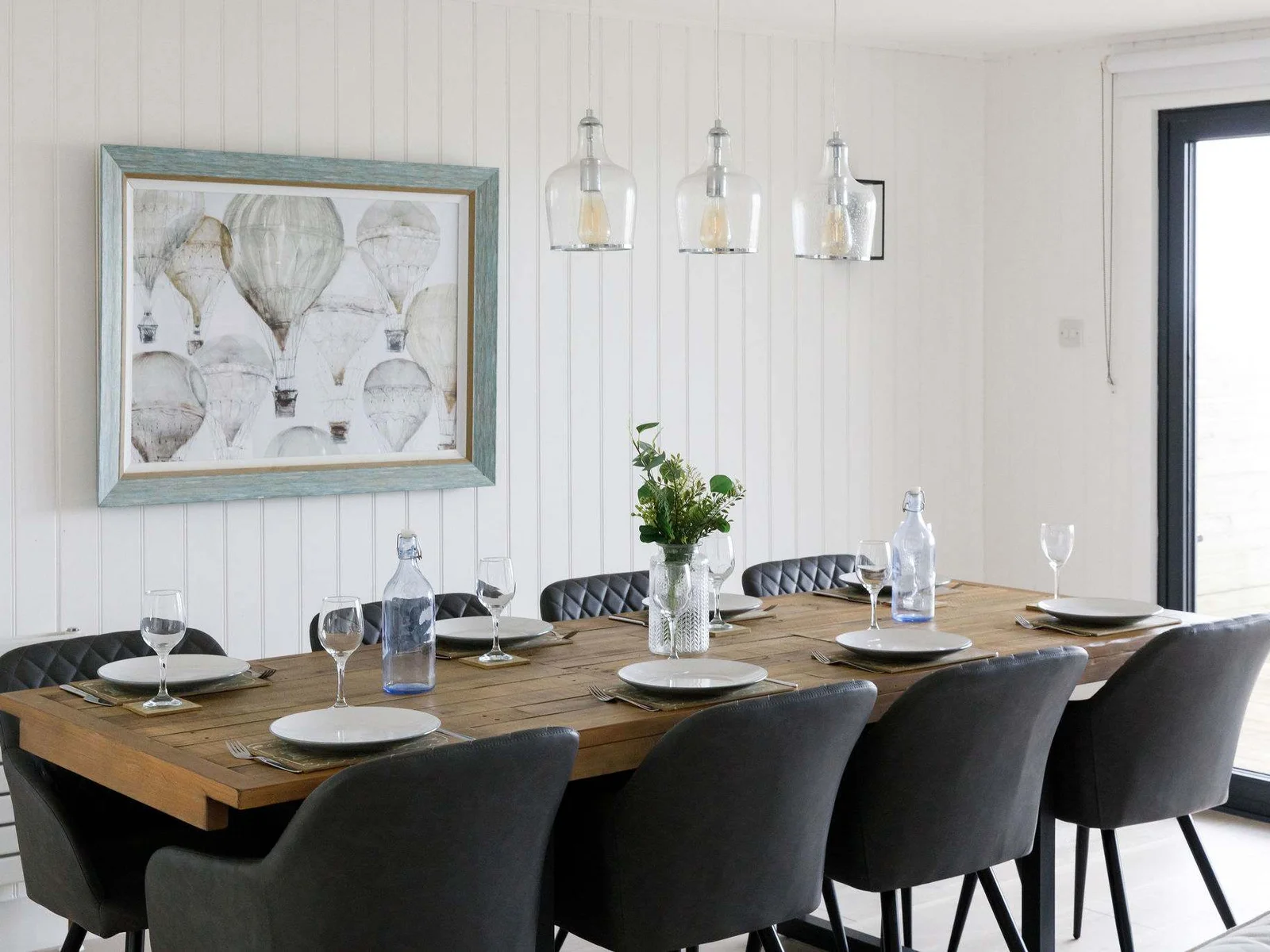The dining table comfortably seats 8 persons.