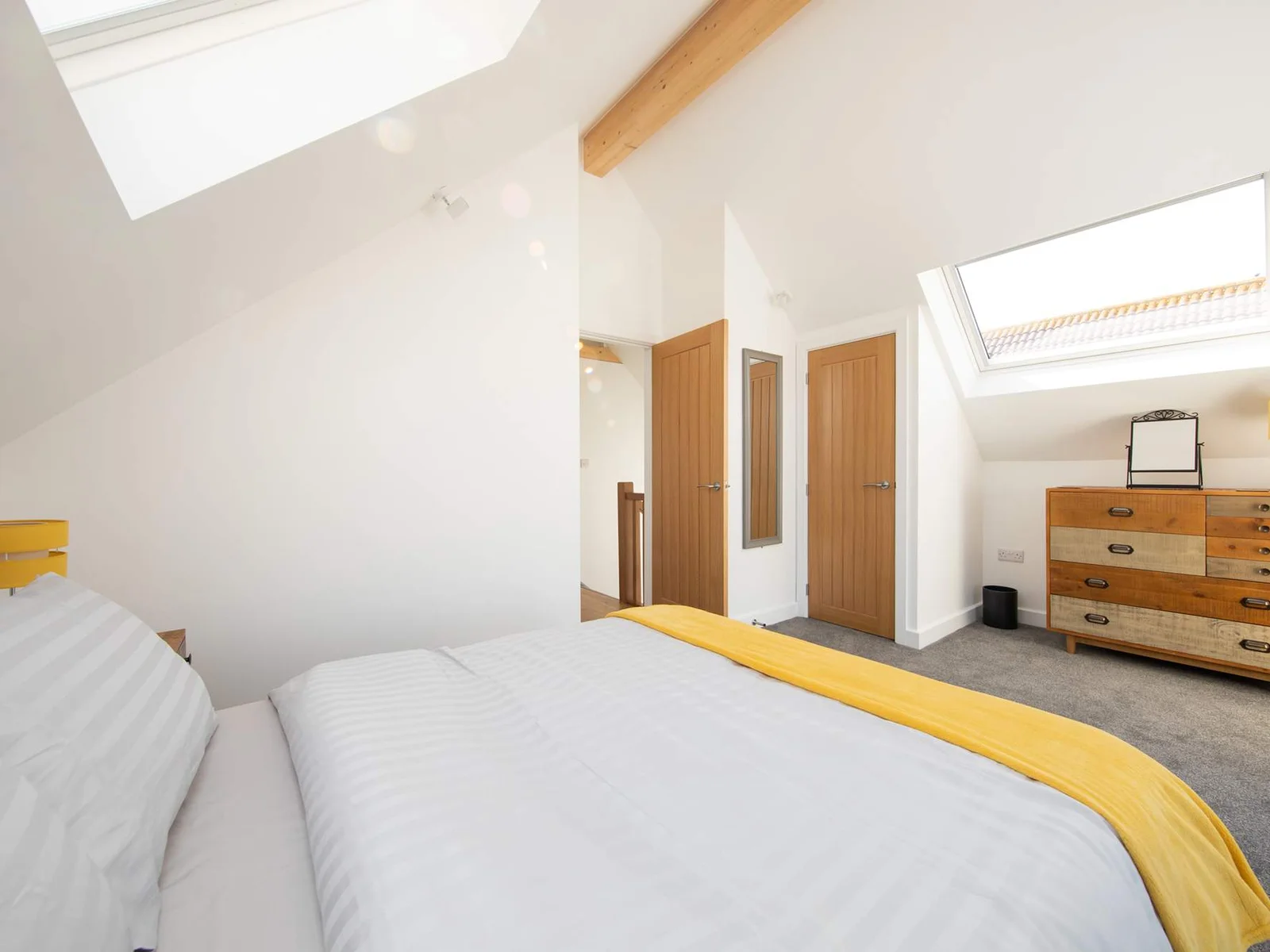 Artsy room with spacious drawers is perfect for keeping your clothes wrinkle-free.