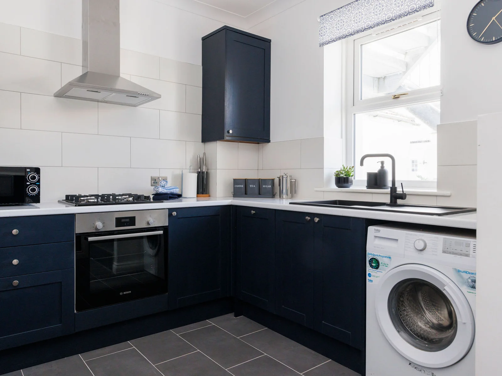 Enjoy preparing meals in the fully equipped kitchen. There is also a washing machine to keep on top of holiday laundry!