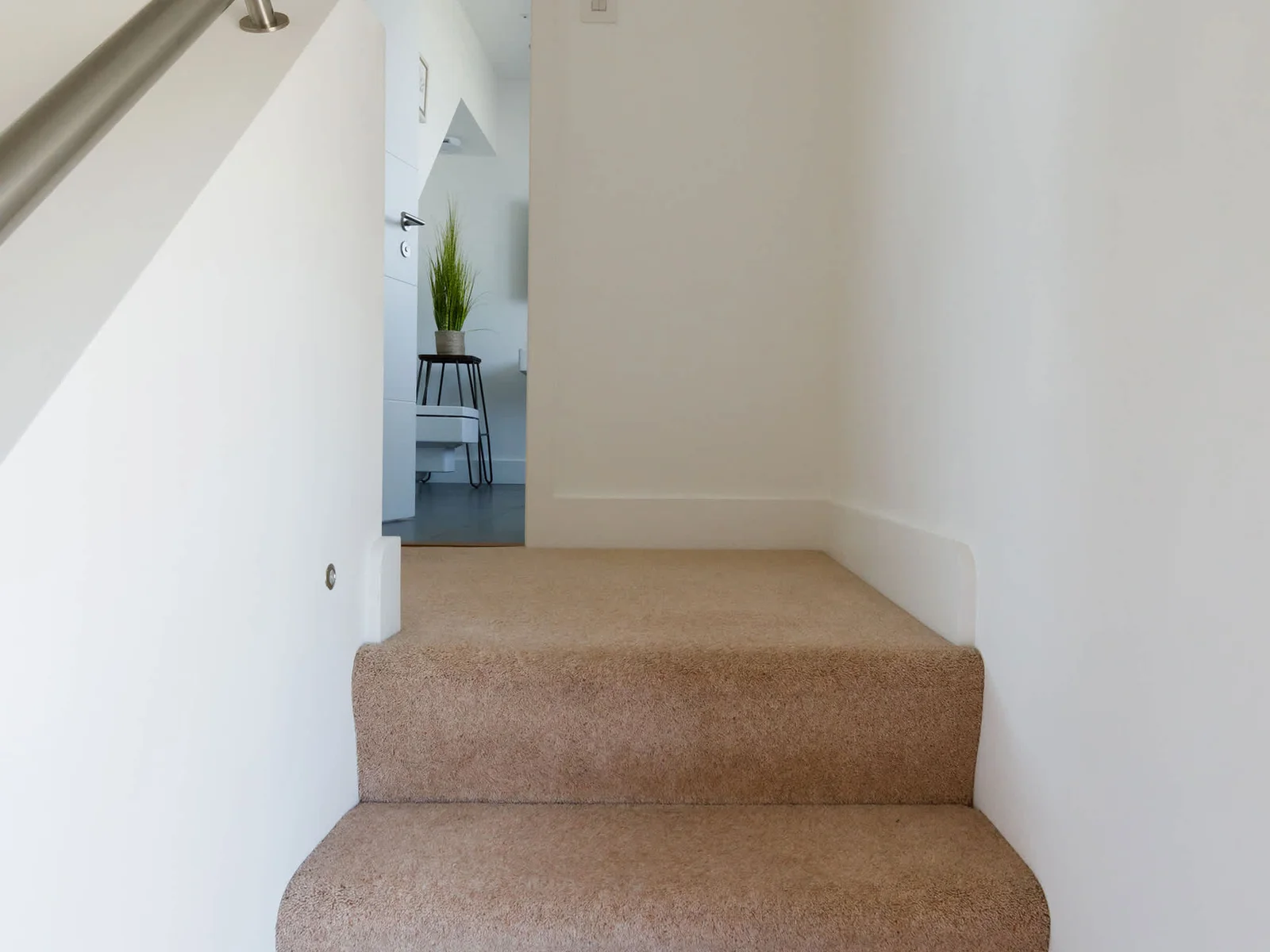 A few easy steps lead to the attic bedroom