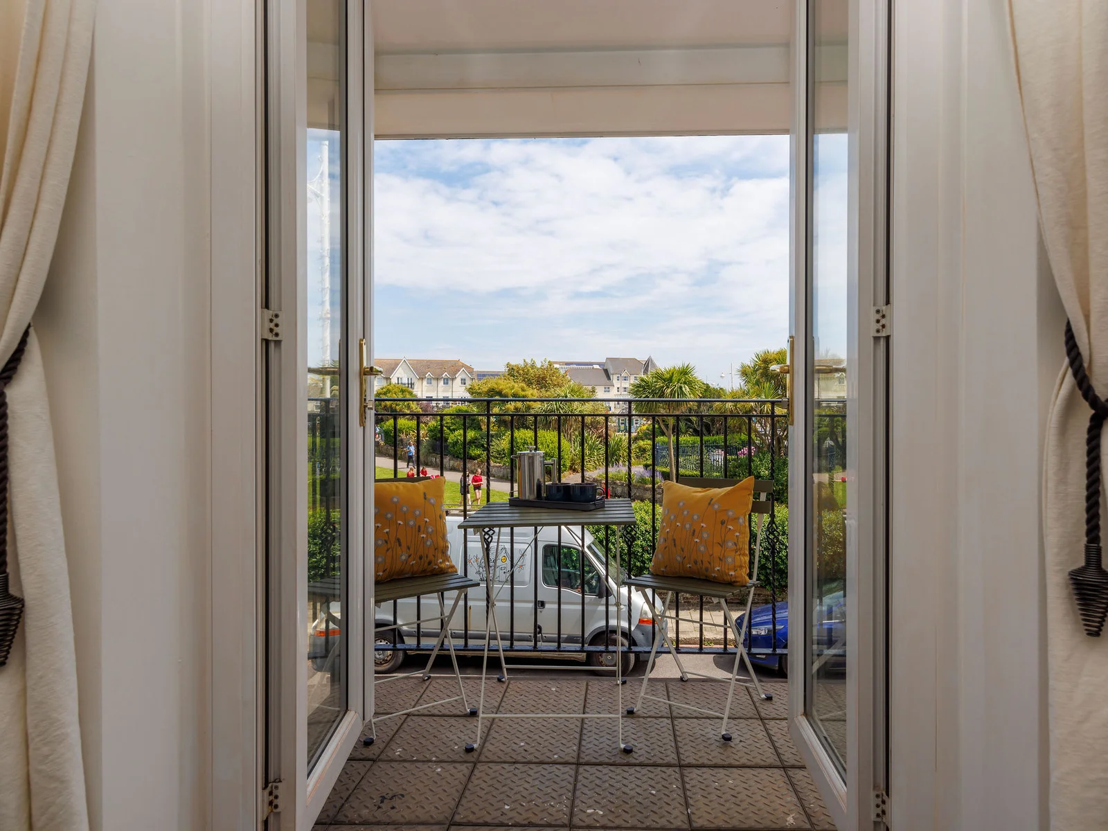 Open up the. balcony doors and let the sea breeze in.