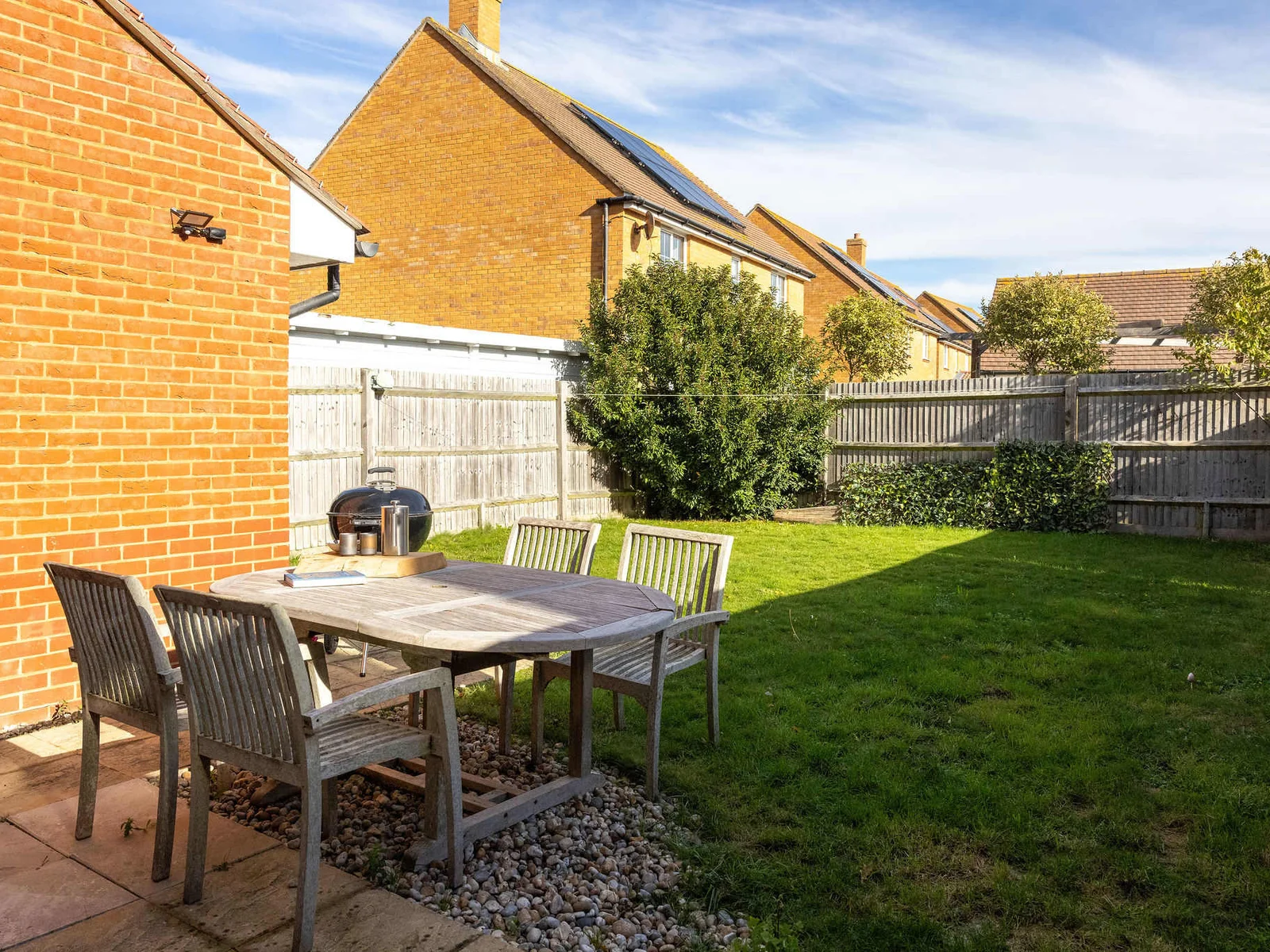 Garden with outdoor furniture and BBQ, perfect for quality family time.