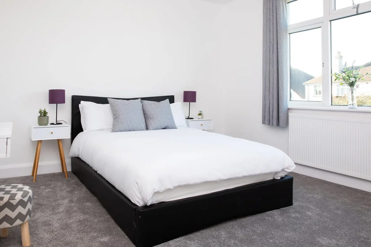 Another angle on the double bed in this bright and welcoming bedroom.