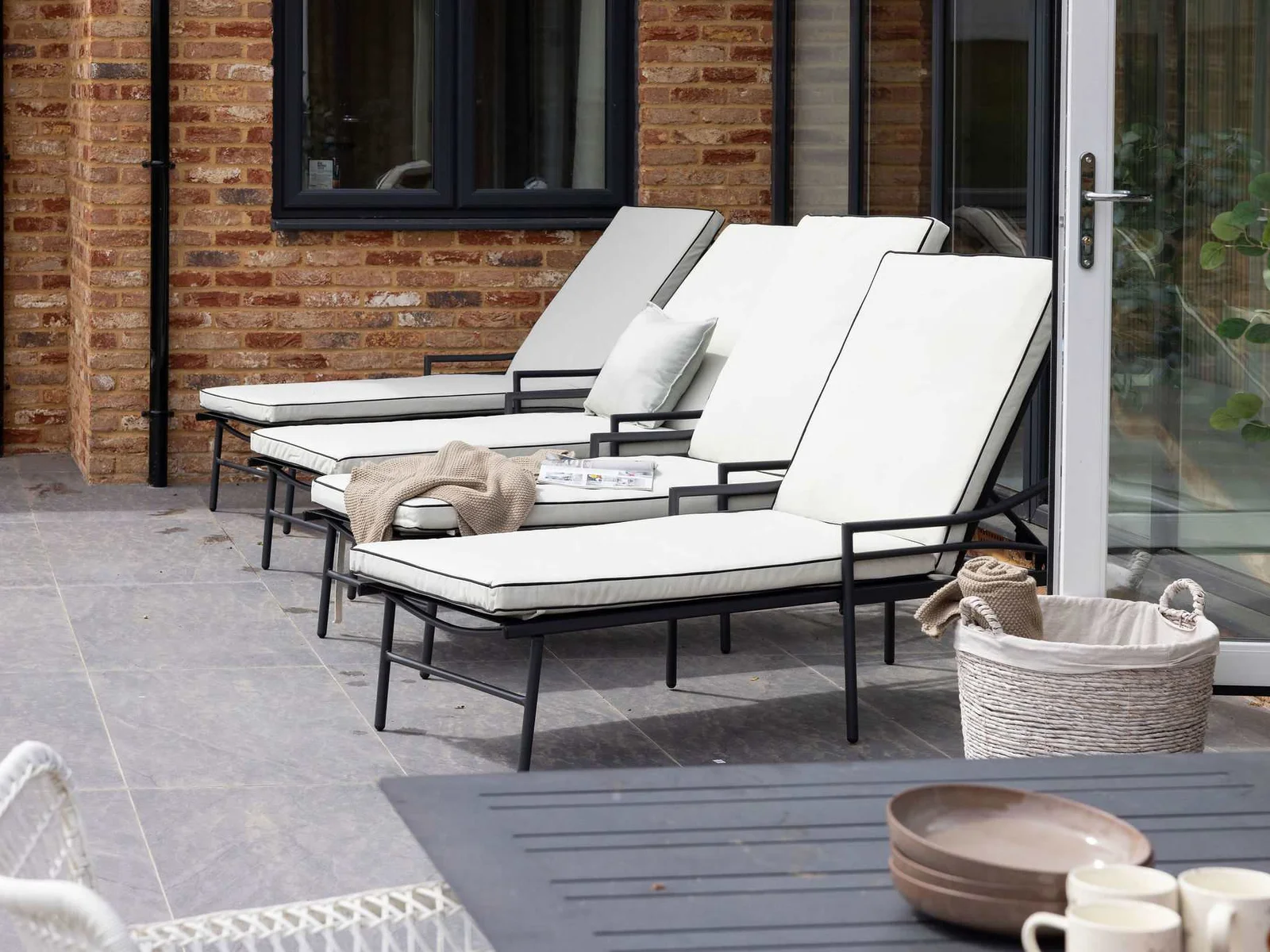 Comfortable sunloungers on the private patio for relaxing outdoors