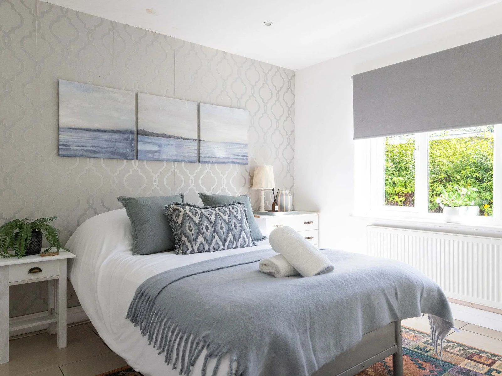Settle into this beautifully decorated bedroom with coastal touches during your relaxing family holiday.