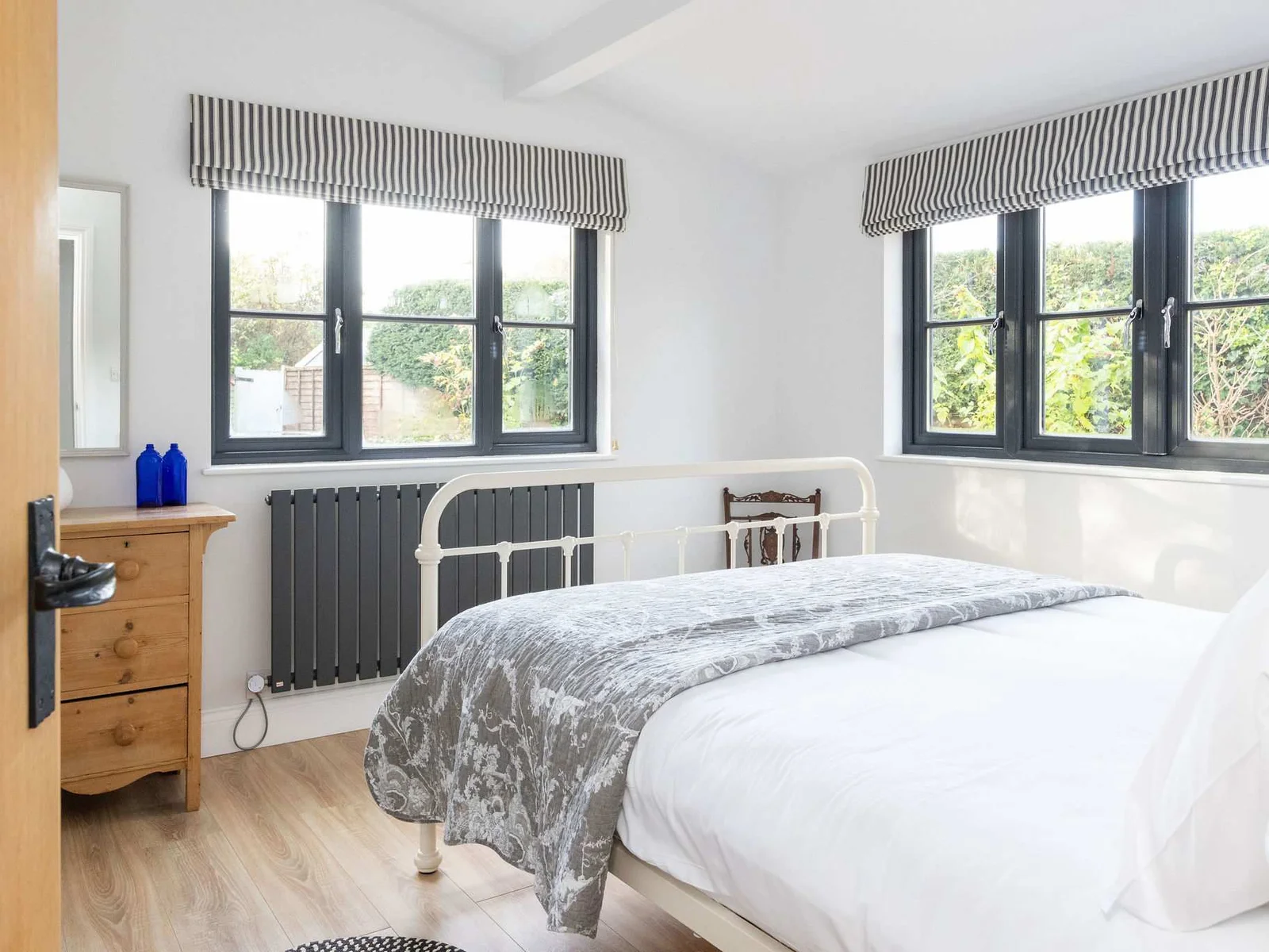 Light-filled bedroom with classic details